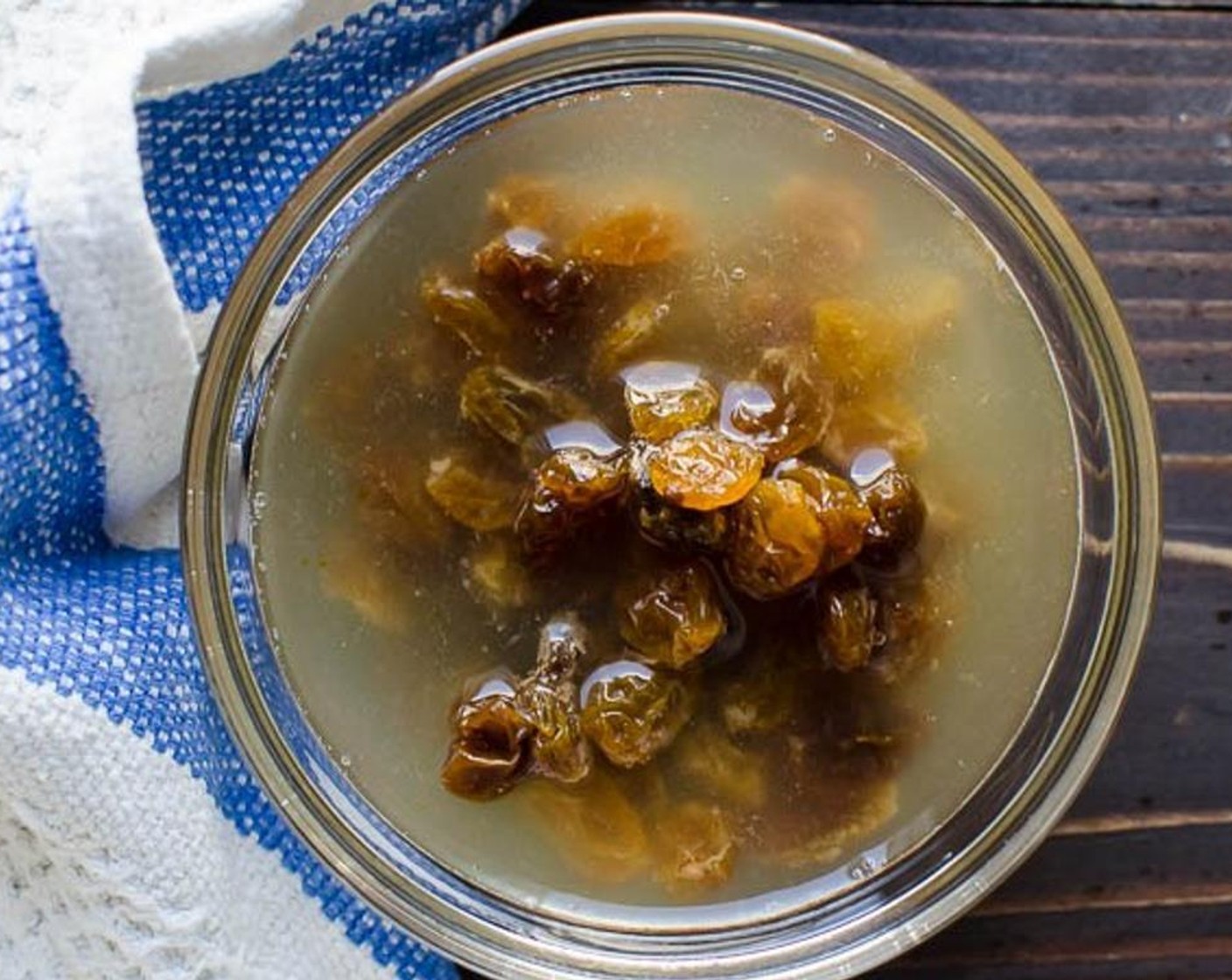 step 2 Add the Vegetable Broth (4 Tbsp) to a small bowl and heat for thirty to forty five seconds in the microwave. Add the Golden Raisins (1/3 cup) to the broth and set aside to plump.