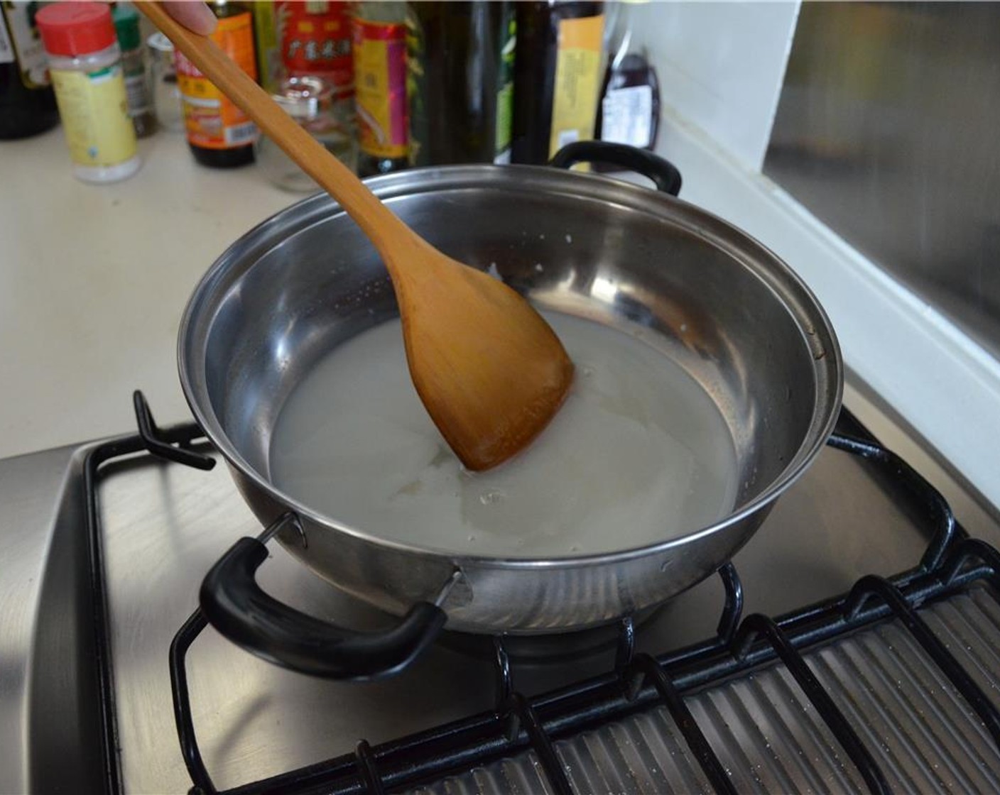 step 1 In a pan, bring Milk (4 Tbsp) and white Granulated Sugar (2 cups) to a boil. Boil for about 2 minutes, stirring often.