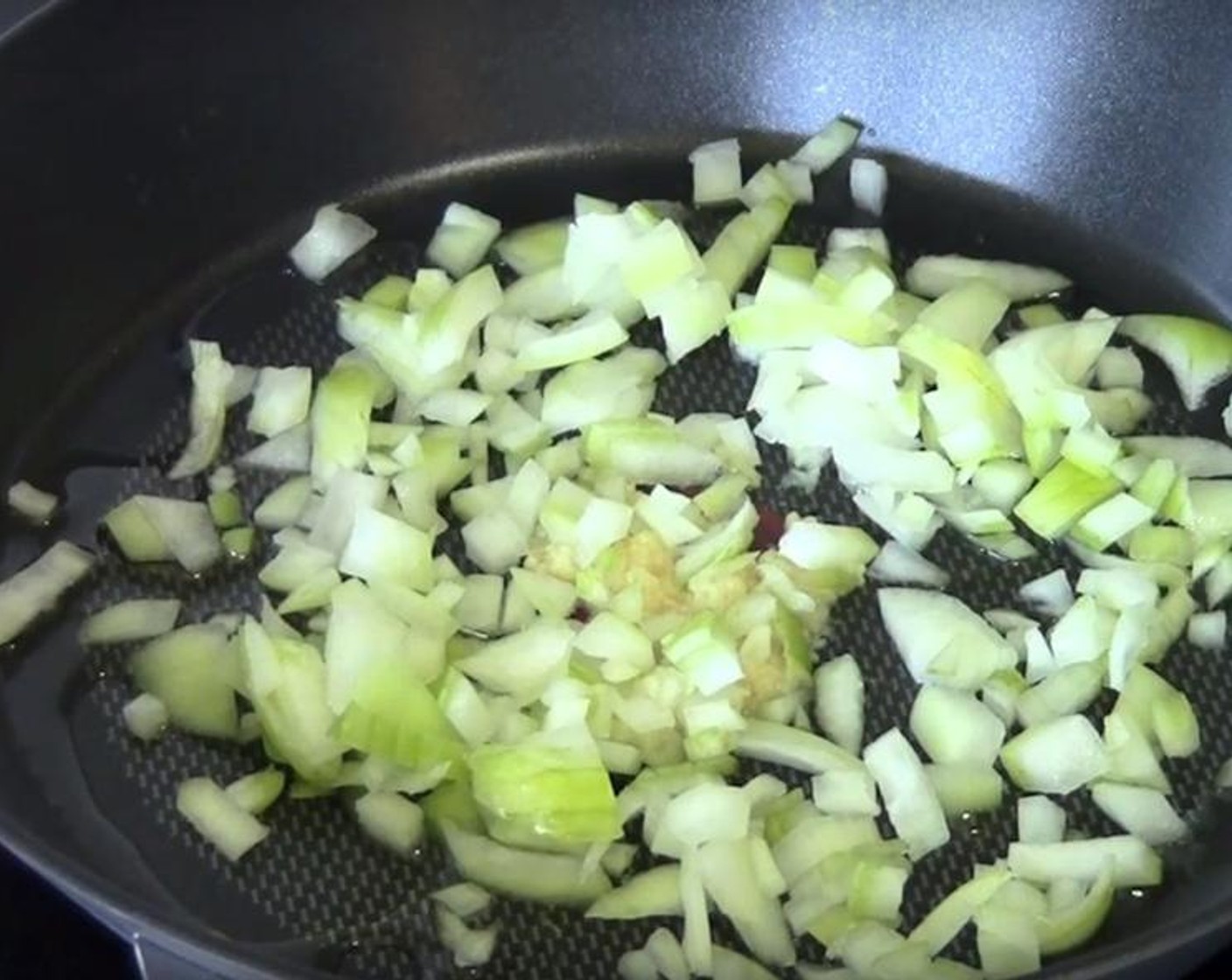 step 1 Put Olive Oil (as needed) into a frying pan. Add Garlic (1 clove) and Yellow Onion (1/2). Cook them over medium heat for two minutes. Turn off the heat and transfer to a bowl.