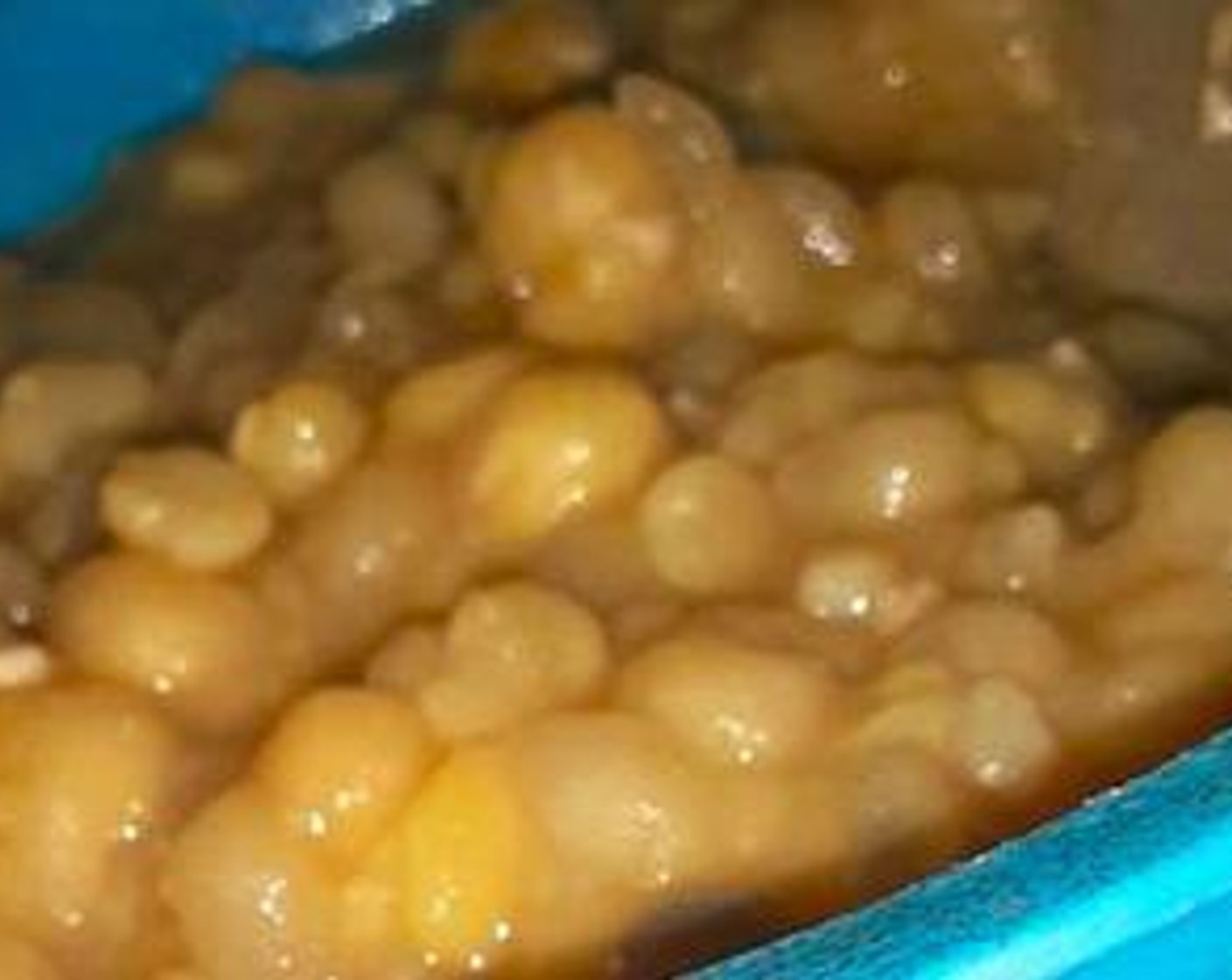 step 3 Strain the peas to discard any water. Remove any of those thin white skins. Leave them in the strainer.  Mash the peas with the backside of a karchi.