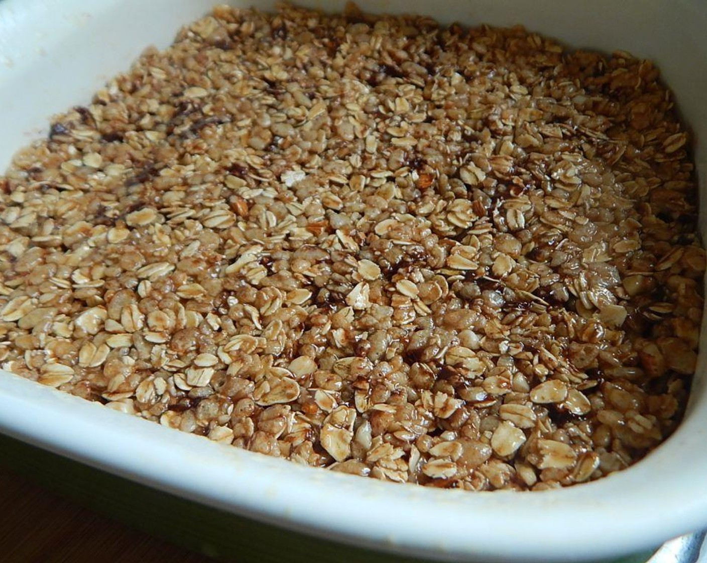 step 4 Spoon the mixture into your 9-inch pan. Slightly wet your hands and pat down on the mixture until it is even in the pan. Use a knife to cut into 16 squares while mixture is soft and in the dish.