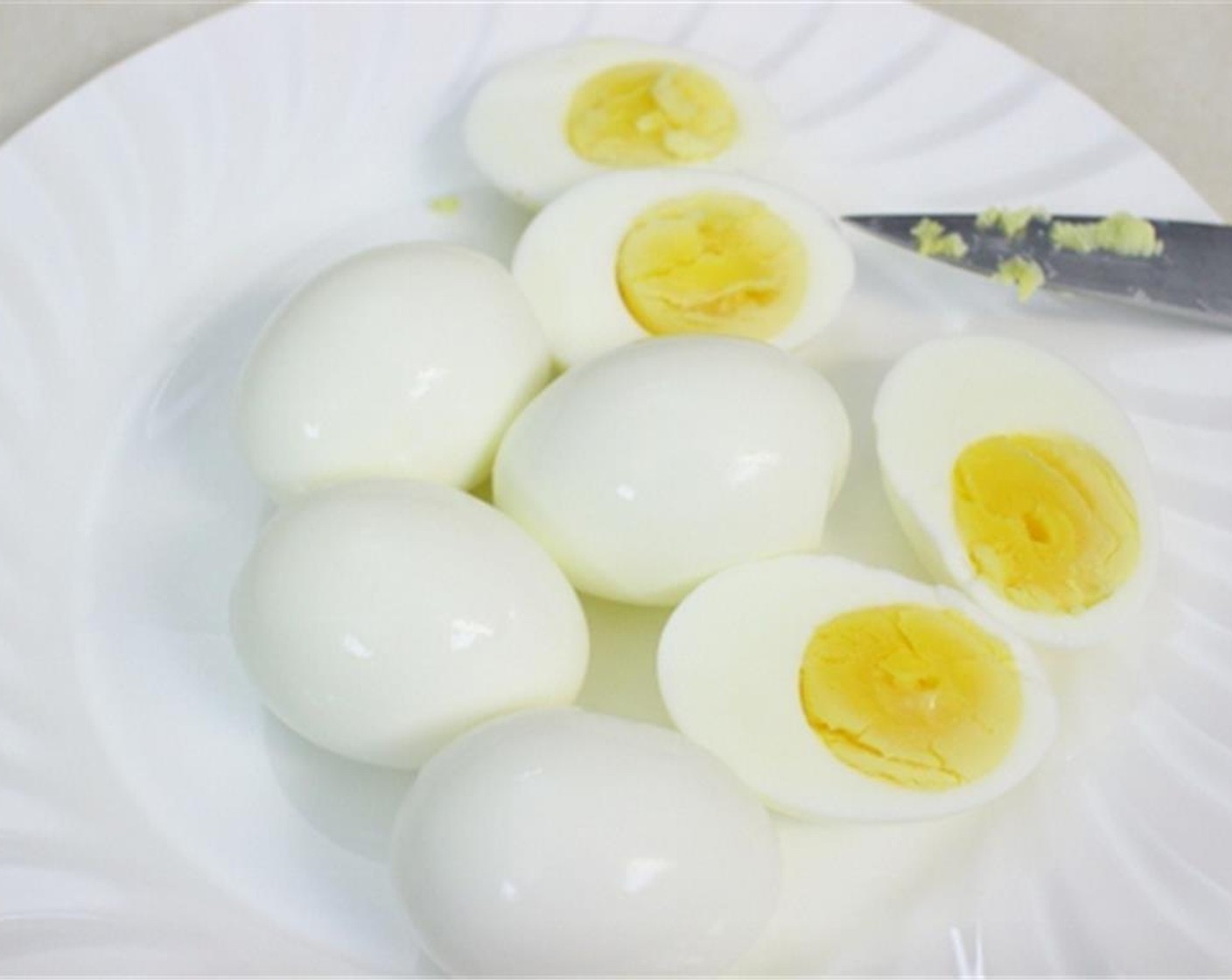 step 5 Hard boil the whole Eggs (6). Peel the eggs and cut them in half to separate the egg whites from the egg yolks.