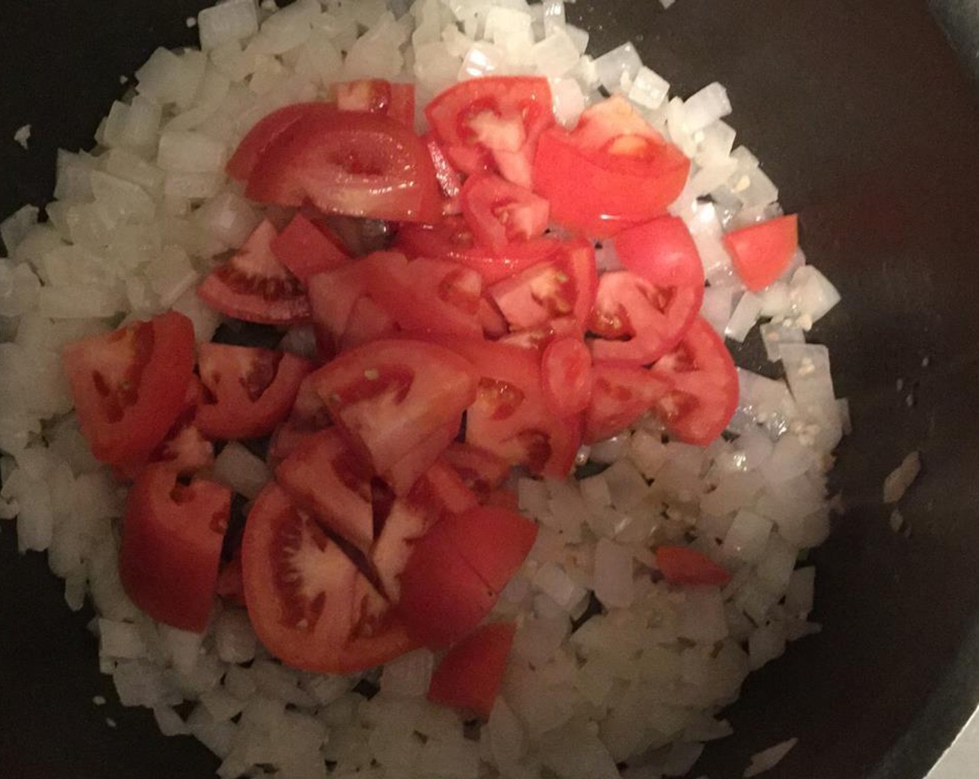 step 4 Roughly chop the Plum Tomatoes (2) and add them into the pot.