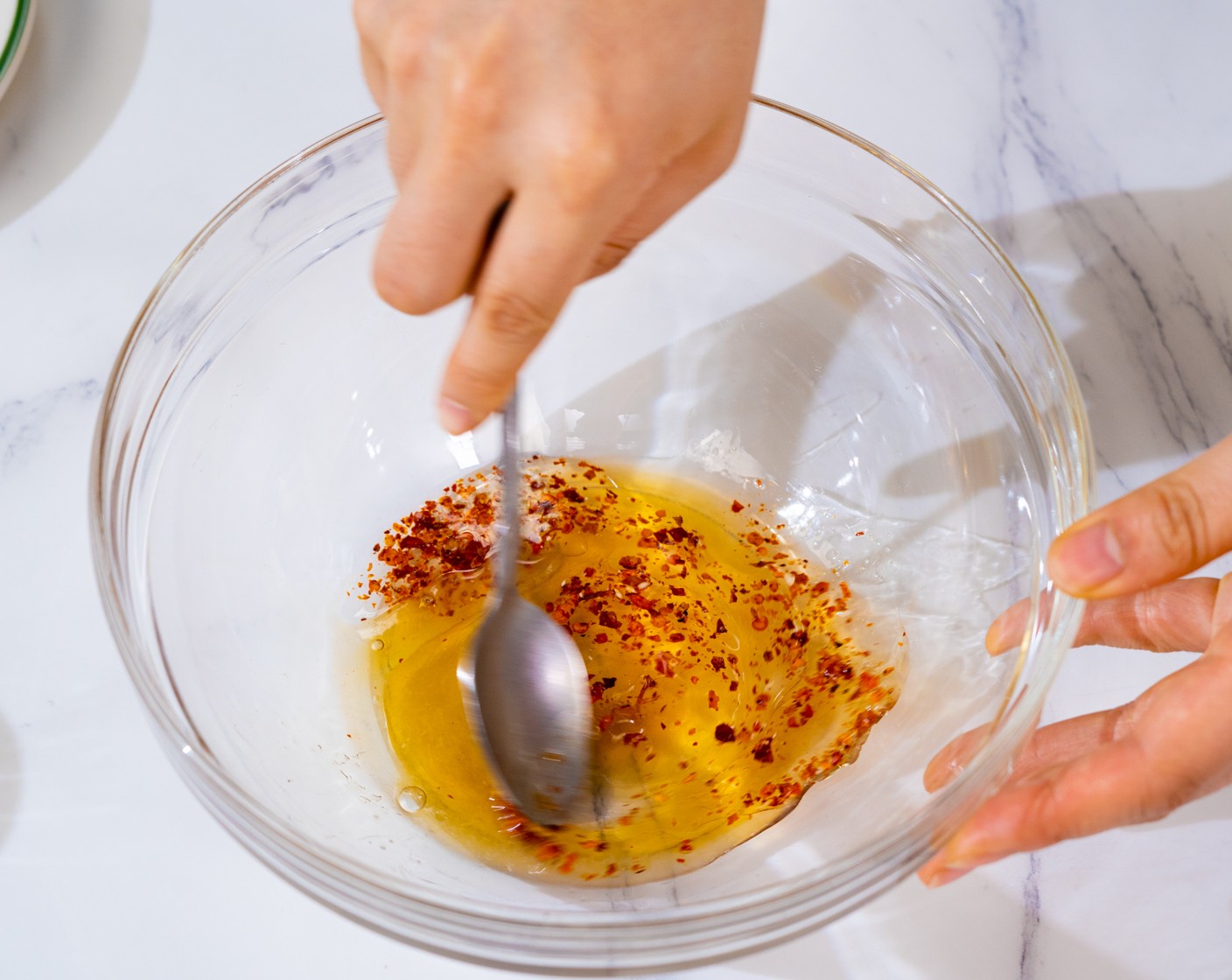 step 3 In a large bowl, add Fish Sauce (1 Tbsp), Lime (1/4), Honey (1/2 Tbsp), Vegetable Oil (1 Tbsp), and Crushed Red Pepper Flakes (1/2 tsp). Mix well to combine.