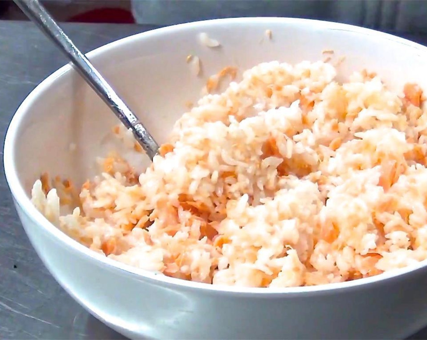 step 6 In a separate bowl, combine Salmon (1 can), cooked White Rice (1/3 cup), Sesame Oil (1 Tbsp), Salt (to taste) and Sesame Seeds (1 Tbsp).