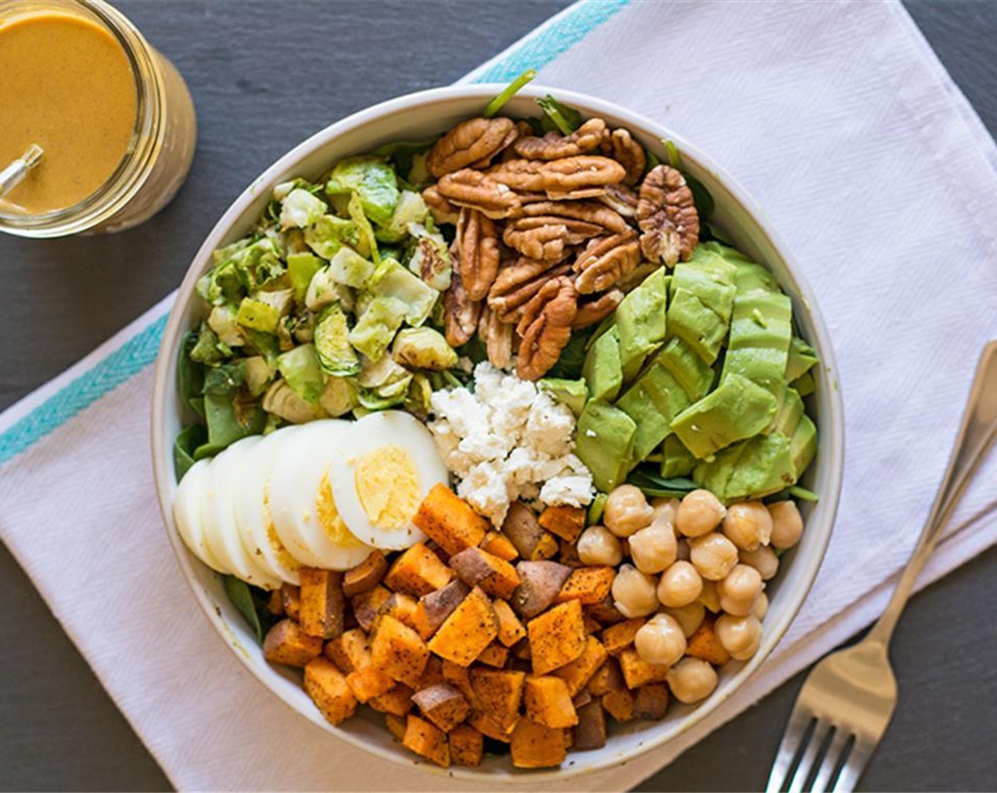 step 10 Add cooked veggies to the salad bowls and top with the dressing.