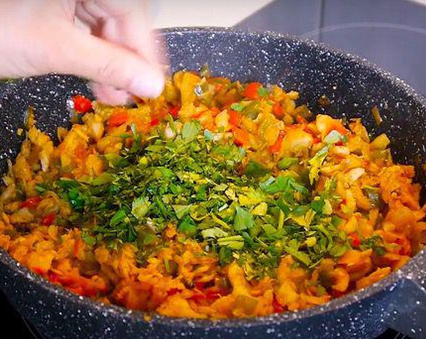 step 6 When the fish is done turn off the heat and add the Fresh Cilantro (1 handful), Fresh Parsley (1 handful) mix and leave to cool down.