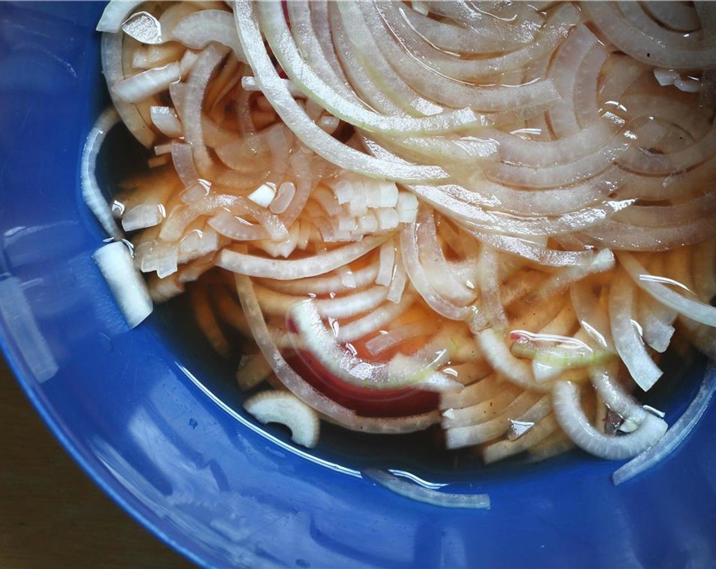 step 5 Thinly slice the Red Onion (1/2). Pickle the it by submerging it in the Apple Cider Vinegar (1 cup), half of the Rice Vinegar (1 1/2 cups) and white Granulated Sugar (2 Tbsp).