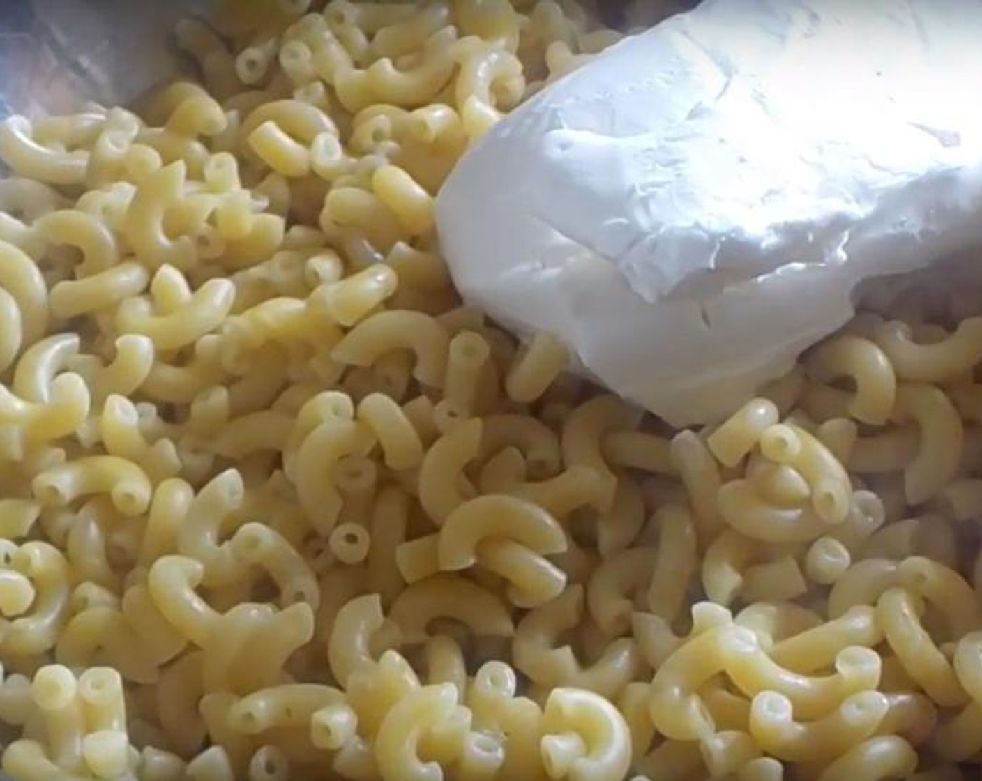 step 2 Into a mixing bowl, add Elbow Macaroni (1 lb), Cream Cheese (1 cup) and Unsalted Butter (1/3 cup). Mix well.