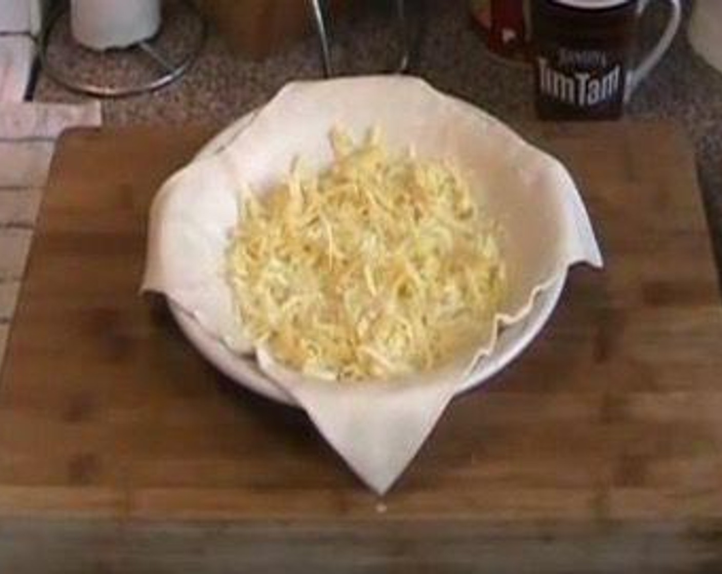 step 1 Place Puff Pastry (1 sheet) into a pie plate. Sprinkle Cheese (1/2 cup) over the bottom.