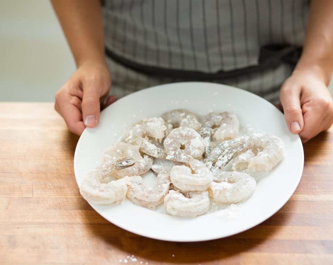 step 5 Place the Corn Starch (4 Tbsp) in another medium
bowl. Pat dry the Shrimp (12) with paper towels and then dredge in the cornstarch, making sure they are evenly coated. Shake off any excess; hold.
