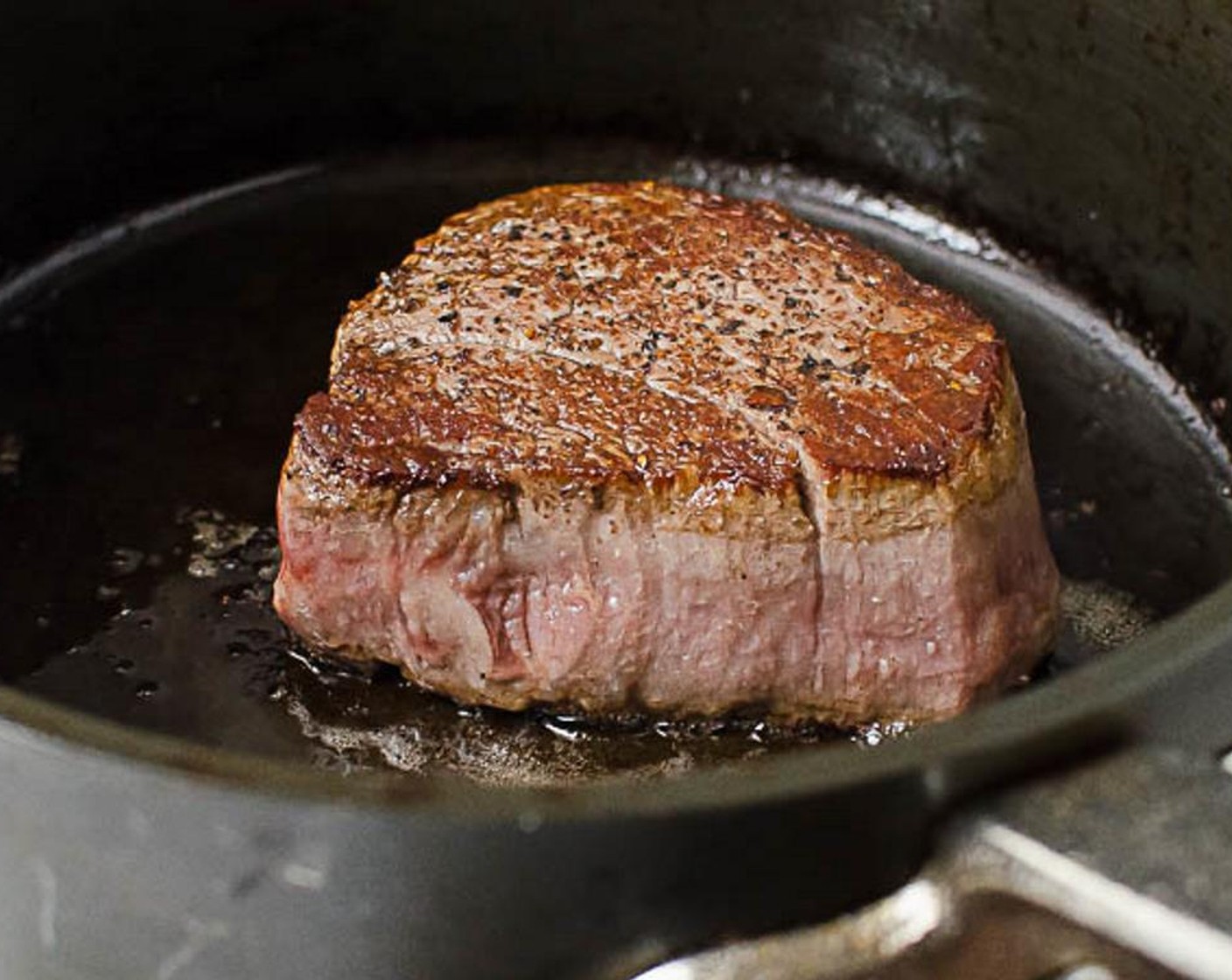 step 11 Use a pair of tongs to flip the steaks. Cook for an additional 1 1/2 to 2 minutes (for medium rare).