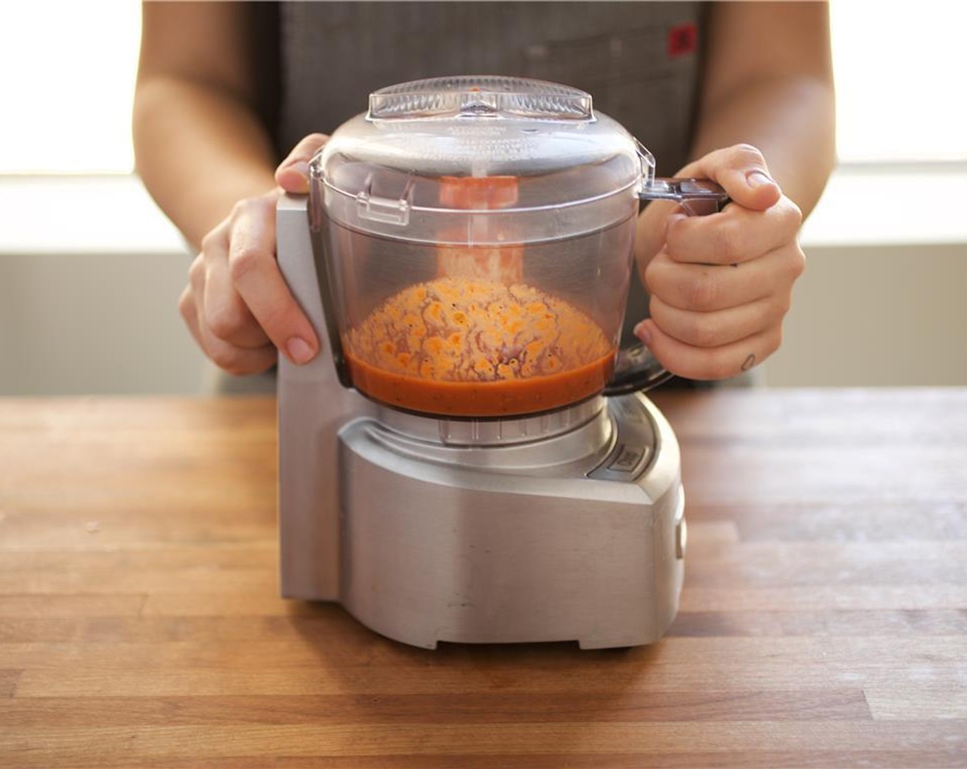 step 13 In the base of a food processor, add the peeled tomato, Chipotle Chili Puree (2 Tbsp), Chicken Base (1 pckg), and Salt (1/4 tsp) and Ground Black Pepper (1/4 tsp). Process until smooth and set aside.