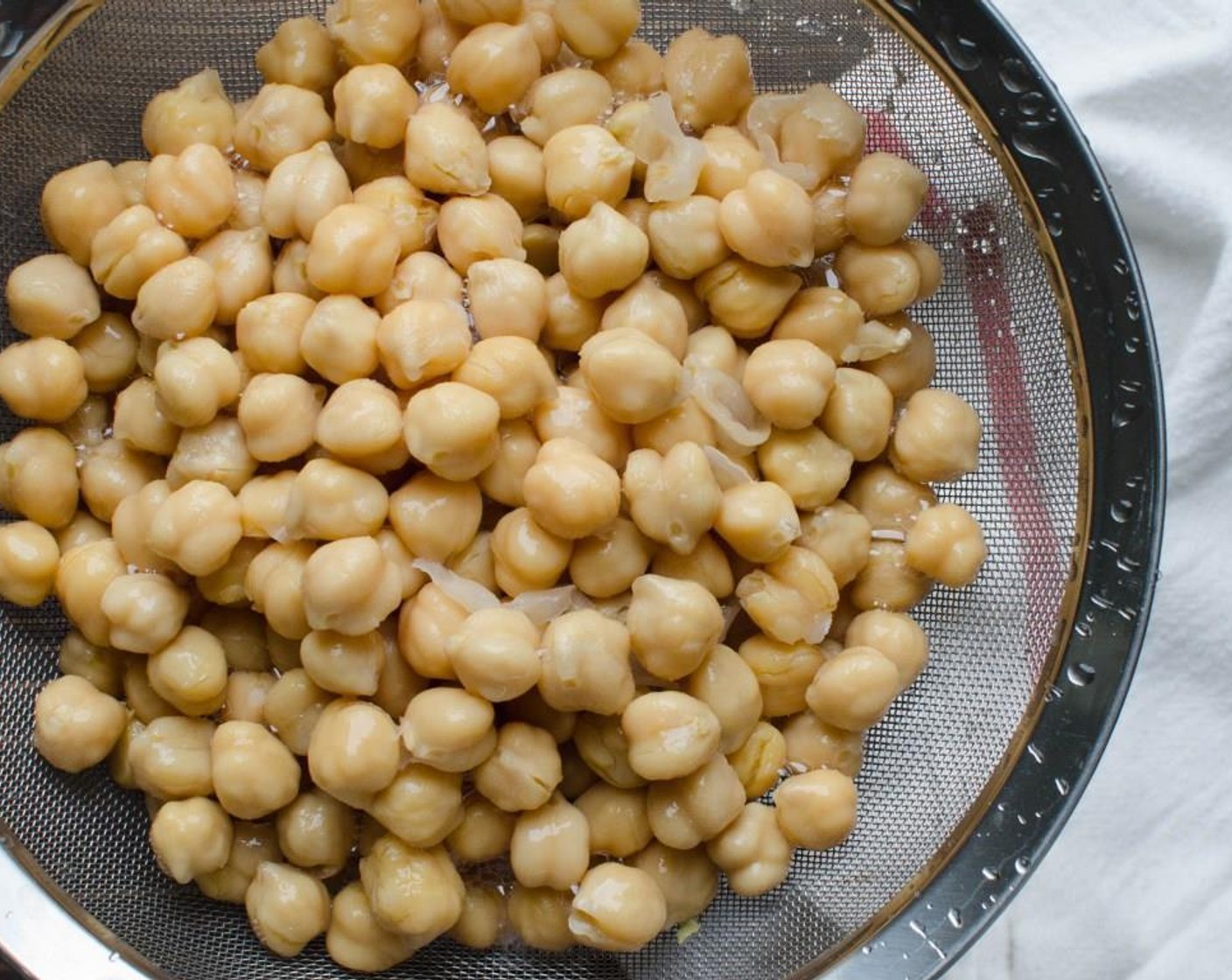 step 2 Rinse and drain the GOYA® Chick Peas (4 cups) in a strainer. Line a large rimmed sheet pan with paper towels.