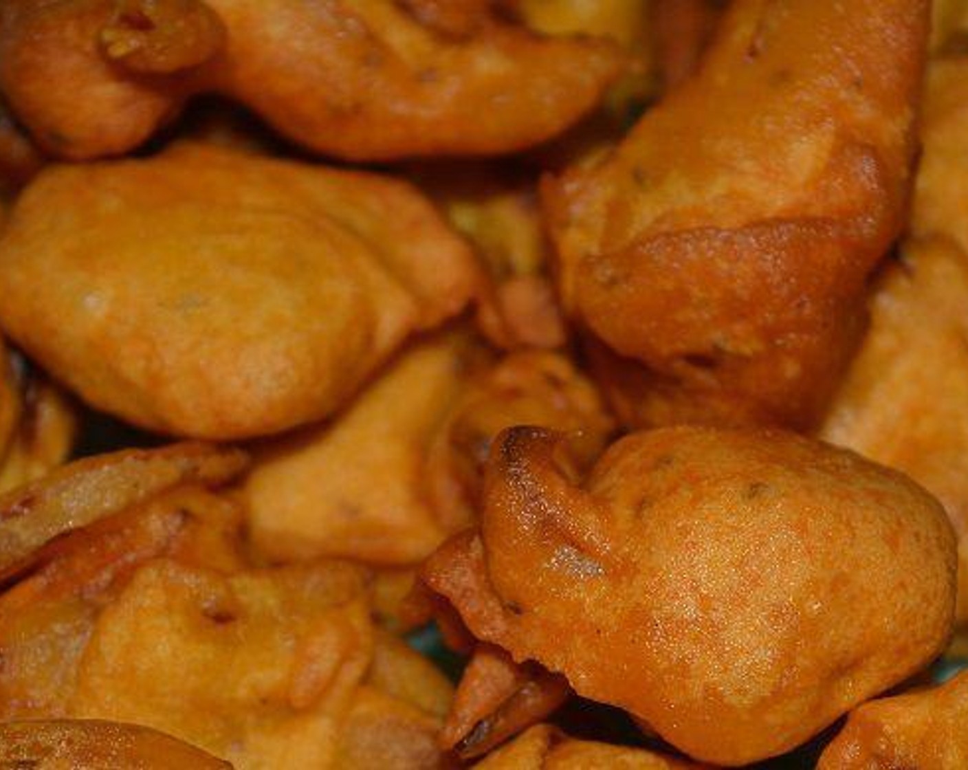 step 4 Heat oil in a kadai and deep fry the pakodas. Using with spoon or hand, take the batter and pour the batter in a kadai, very carefully if you are using your hand. Fry the pakoda's till they crisp and browned.