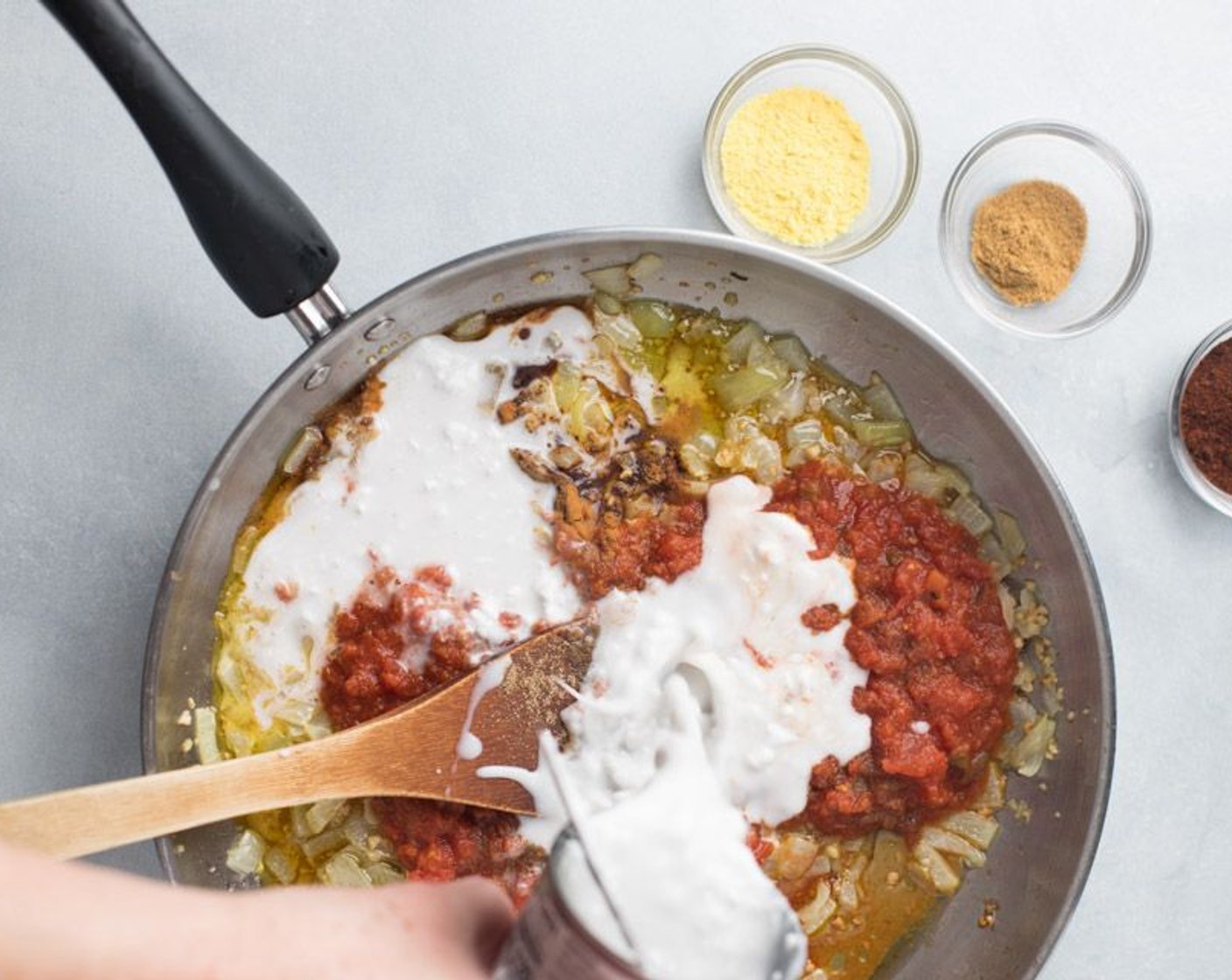 step 3 Add to the skillet the Medium Salsa (1 cup), Coconut Milk (1 can), Chili Powder (2 Tbsp), Ground Cumin (1 tsp), Ground Cinnamon (1/2 tsp), Celery Salt (1/2 tsp) and Sodium-Free Chicken Bouillon (1 Tbsp). Cook for 5 minutes, stirring occasionally.