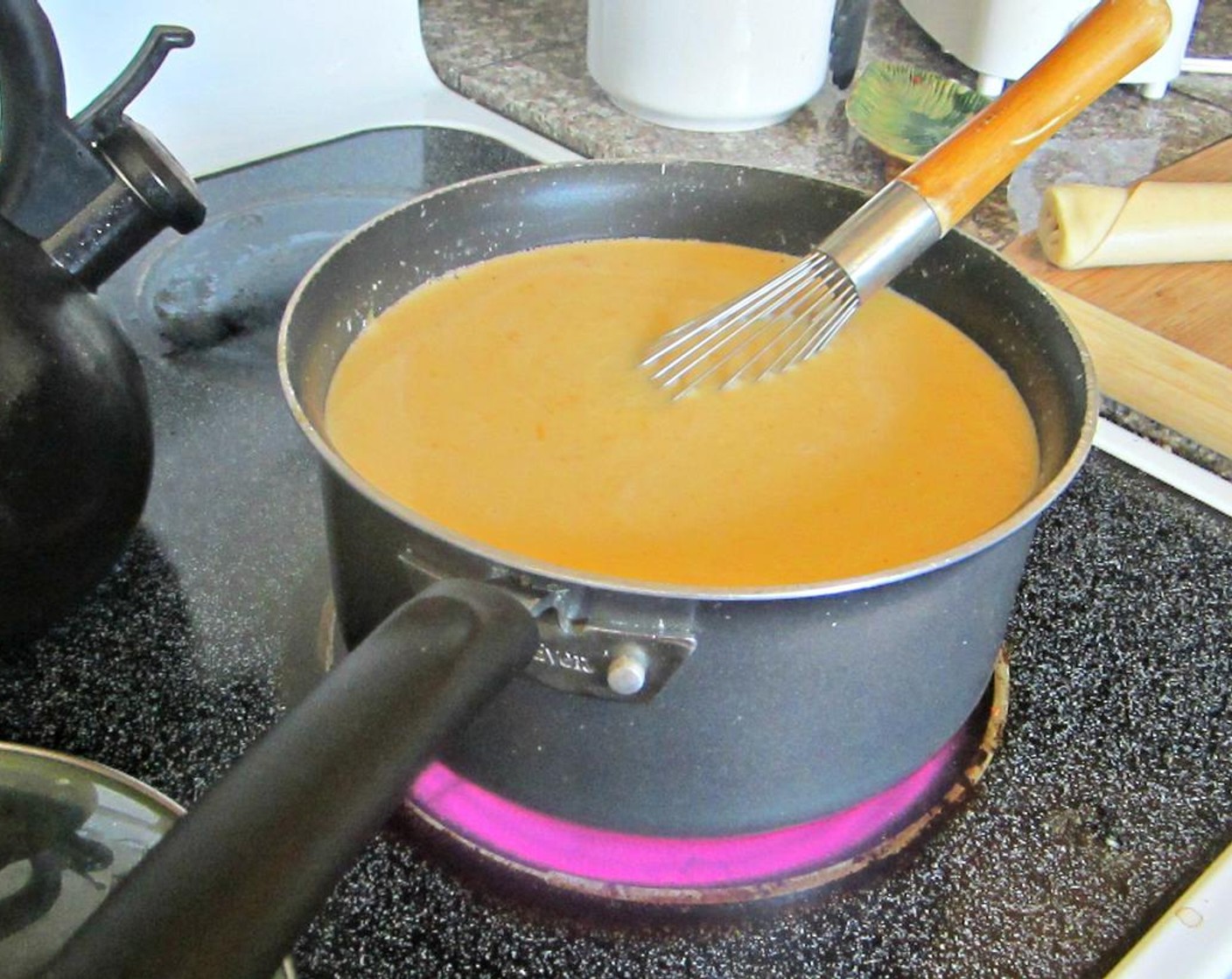 step 1 In a large pot, bring Fat-Free Evaporated Milk (2 cans), Condensed Cheddar Cheese Soup (2 cans), Water (2 1/2 cups), Salt (to taste), Ground Black Pepper (to taste), Dry Mustard (1 tsp), and Cayenne Pepper (1/8 tsp), to a simmer.