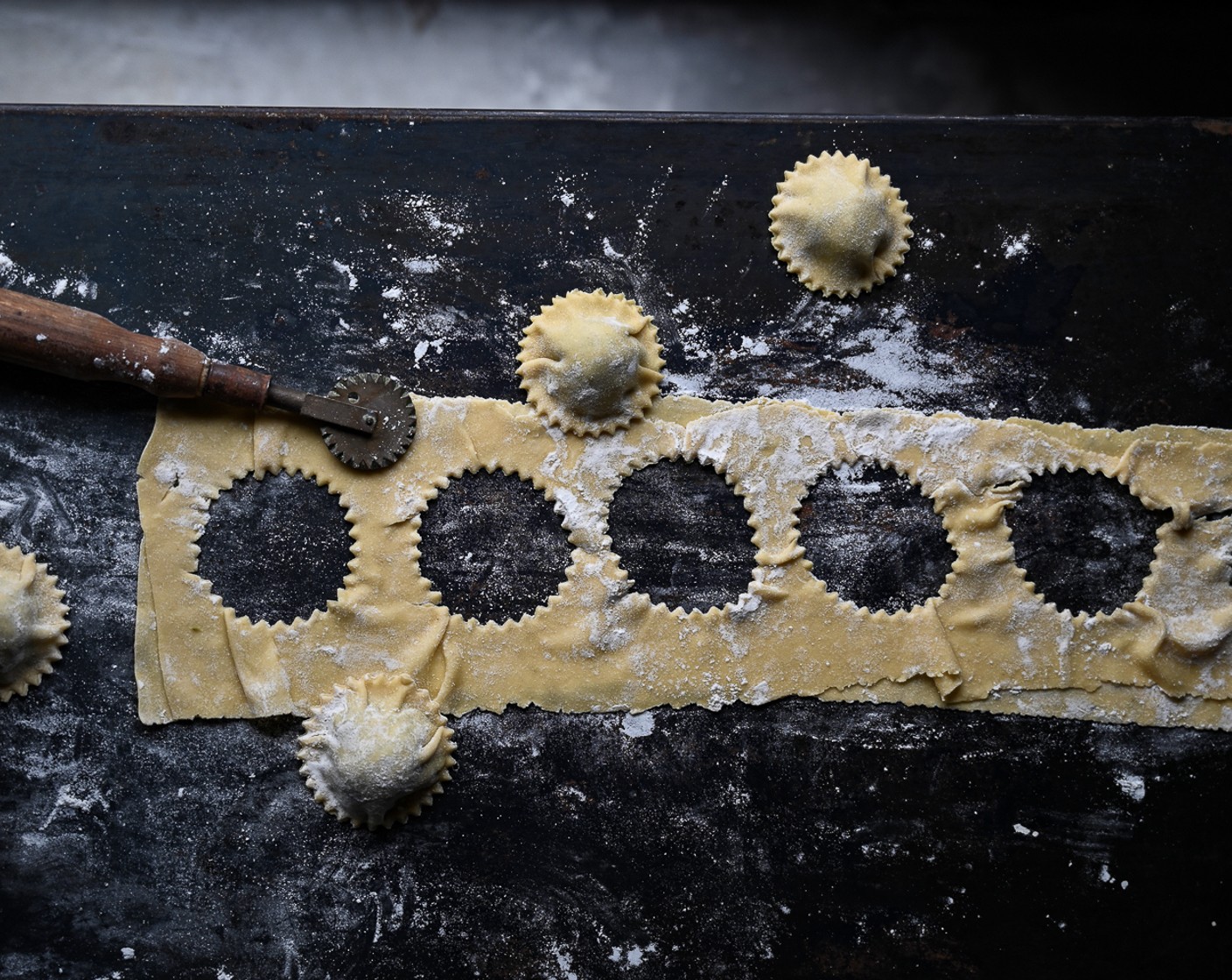 step 11 Seal the edges of the ravioli pockets with a brush of water and if desired, use a ravioli cutter to press out small pockets.