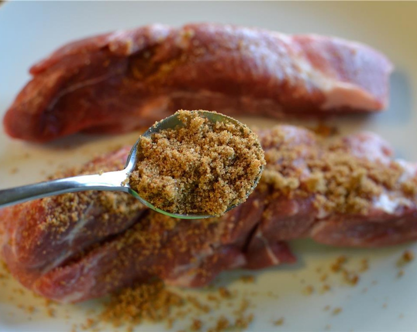 step 3 Spoon over half the dry rub onto the Boneless Pork Ribs (1.5 lb). Make sure you rub it on all sides and rub it into the meat well. Save the other half of the rub for later.