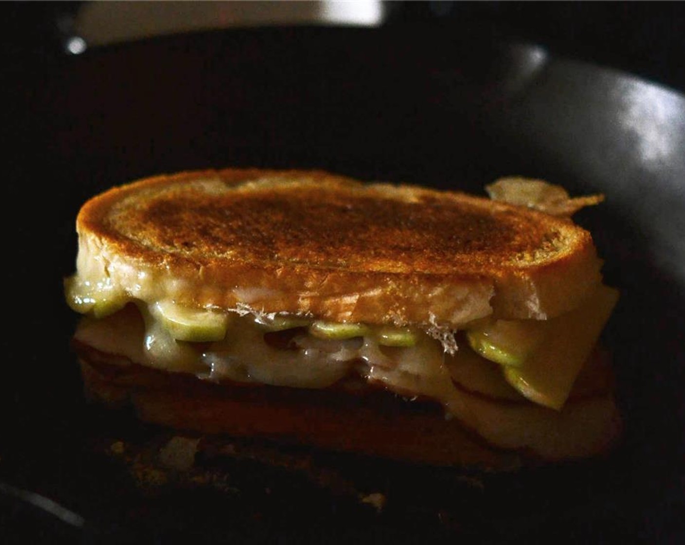step 6 Cook sandwich on medium low heat until bread becomes lightly toasted and golden brown and the cheese begins to melt. About 5 to 8 minutes per side. If the bread begins to brown too fast, reduce temperature.