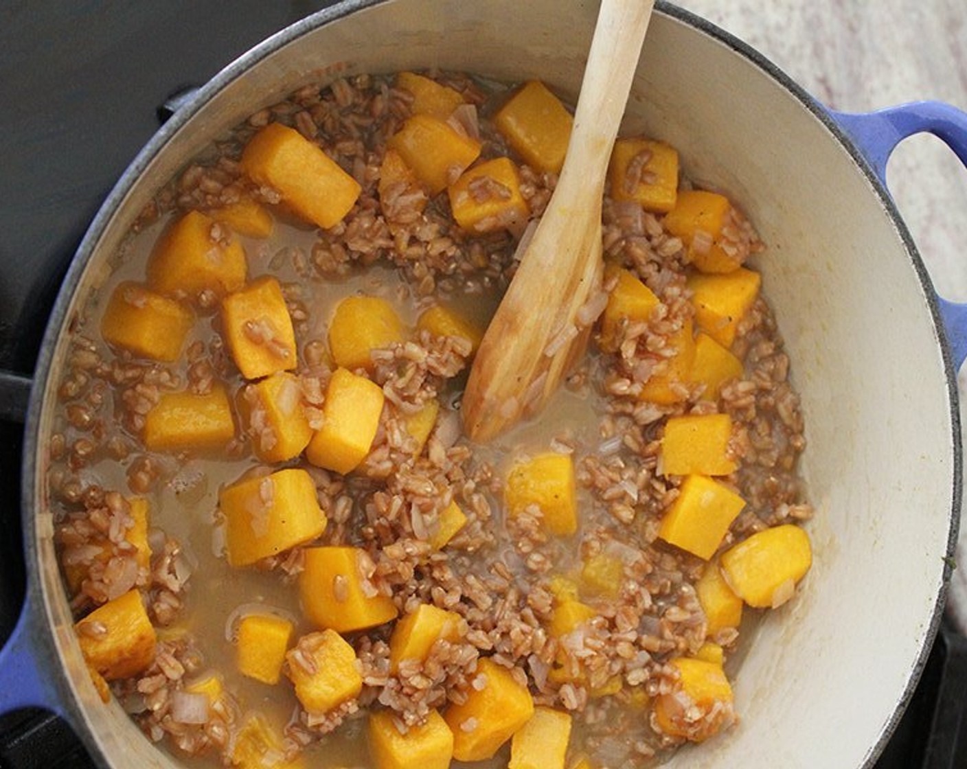 step 11 Add the roasted butternut squash, Kosher Salt (1 tsp), and Ground Black Pepper (1/2 tsp) and cook until heated through, smashing some of the squash with the side of a wooden spoon. Add a splash of broth if the risotto seems dry at this point.