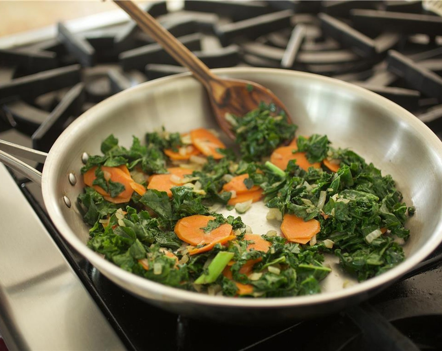 step 6 Add Kale (3 cups) to the pan and saute for one minute.