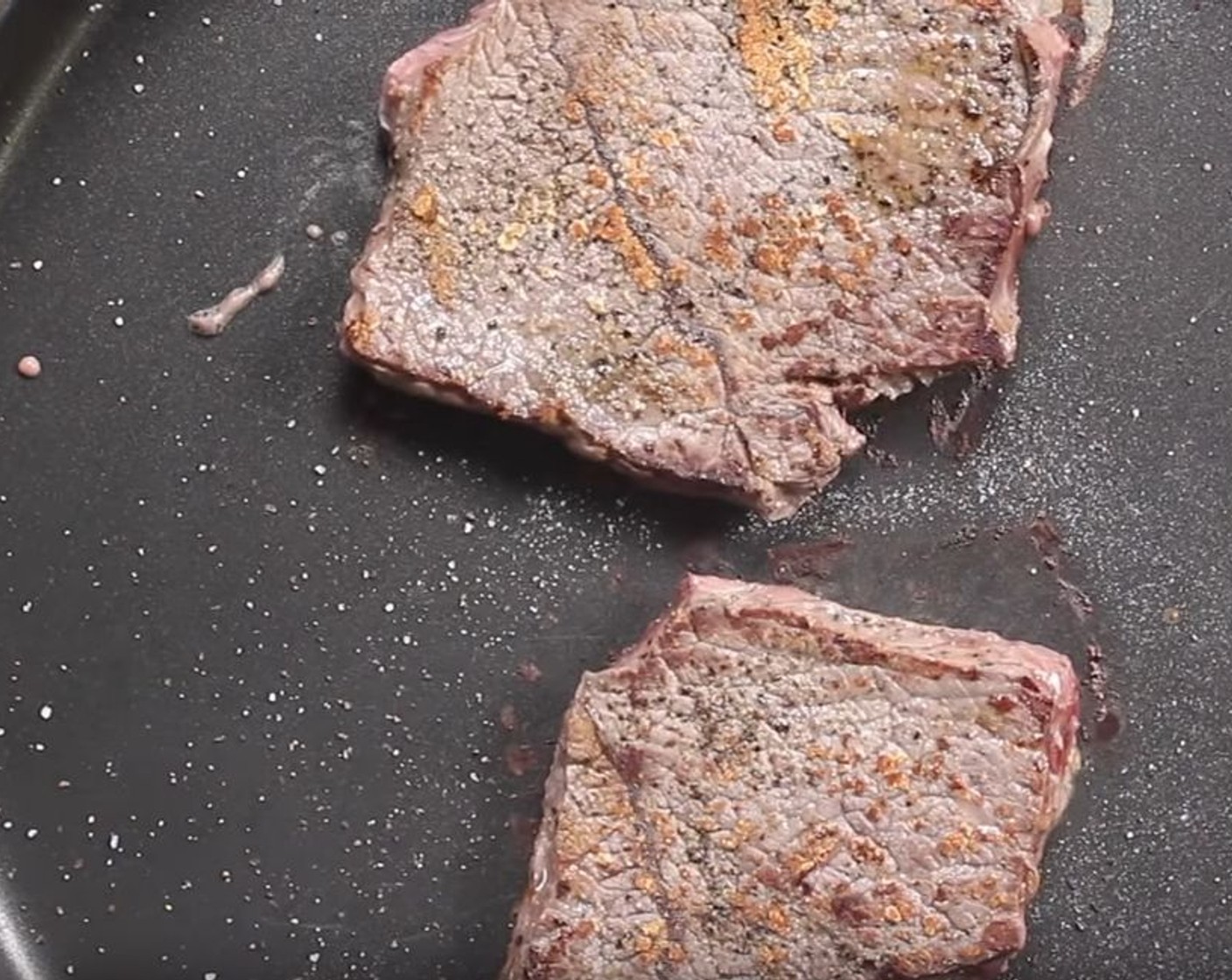 step 4 Take your Beef Steak (2) and season both sides with Salt (to taste) and Ground Black Pepper (to taste). Place them onto a very hot pan with no oil and sear for 2 minutes on each side.