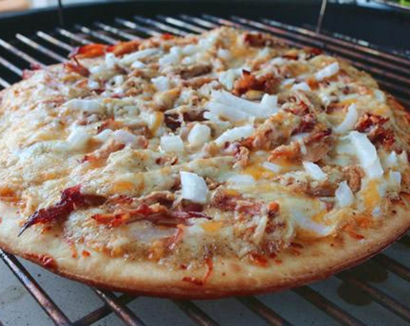 step 5 Use a pizza peel or cutting board to transfer pizza to the grill. Cook each pizza separately for 8-10 minutes or until cheese is melted and crust is brown.