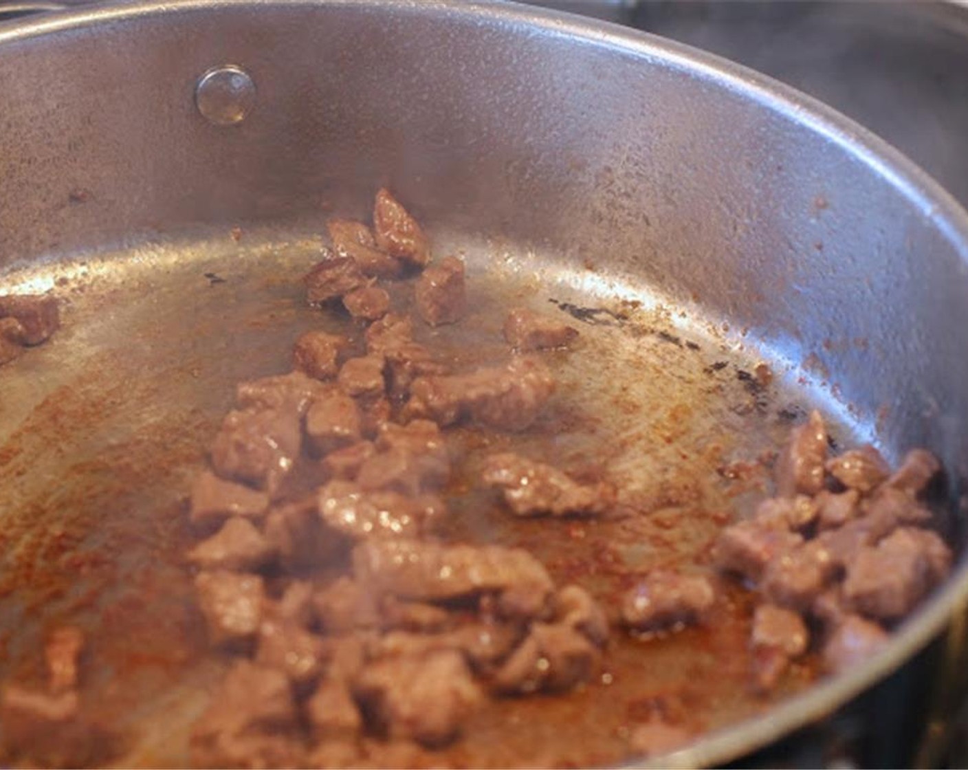 step 1 Brown Beef (2 lb) in Canola Oil (3 Tbsp) in 2-3 batches. I do it in batches to get a better brown, and thus better drippings for the broth. As each batch browns, remove it into a large stock pot.