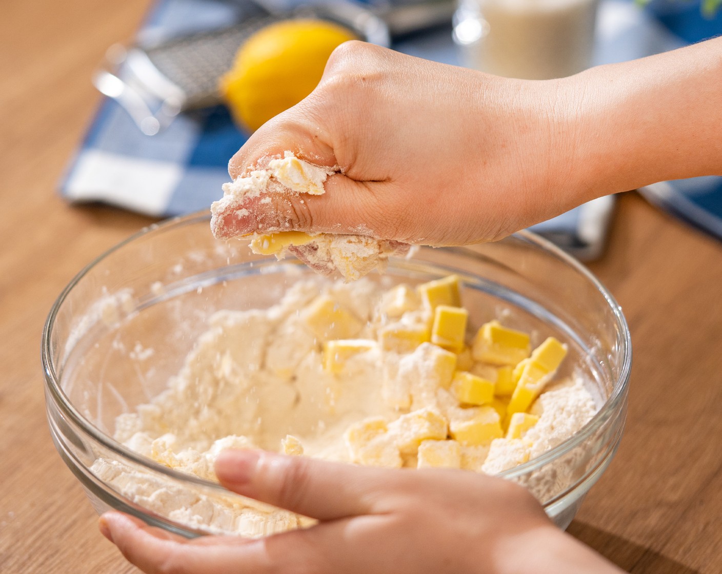 step 2 Add Butter (3/4 cup) to the dry mixture bowl. Using your hands, press the butter cubes into flat pieces.