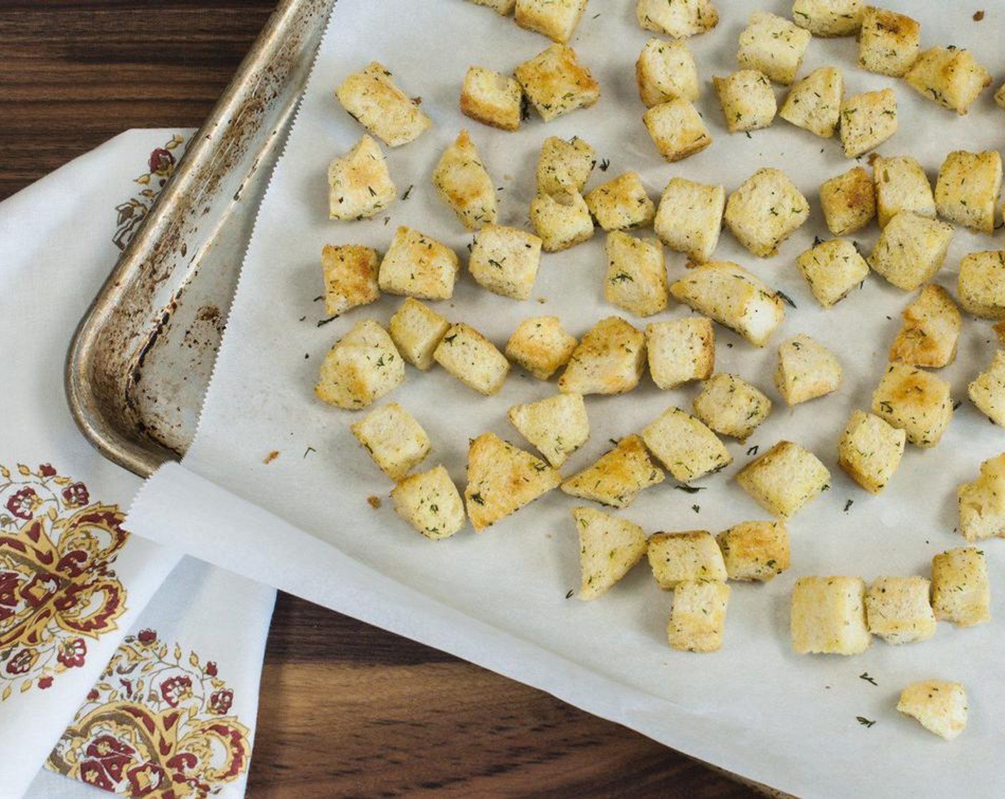 step 2 In a large bowl toss together French Bread (3 cups), Fresh Dill (1 Tbsp), Sea Salt (to taste), and Freshly Ground Black Pepper (to taste). Drizzle with Olive Oil (2 Tbsp) and toss until evenly coated. Spread out in a single layer on a large baking sheet. Bake for 15-18 minutes, turning once.