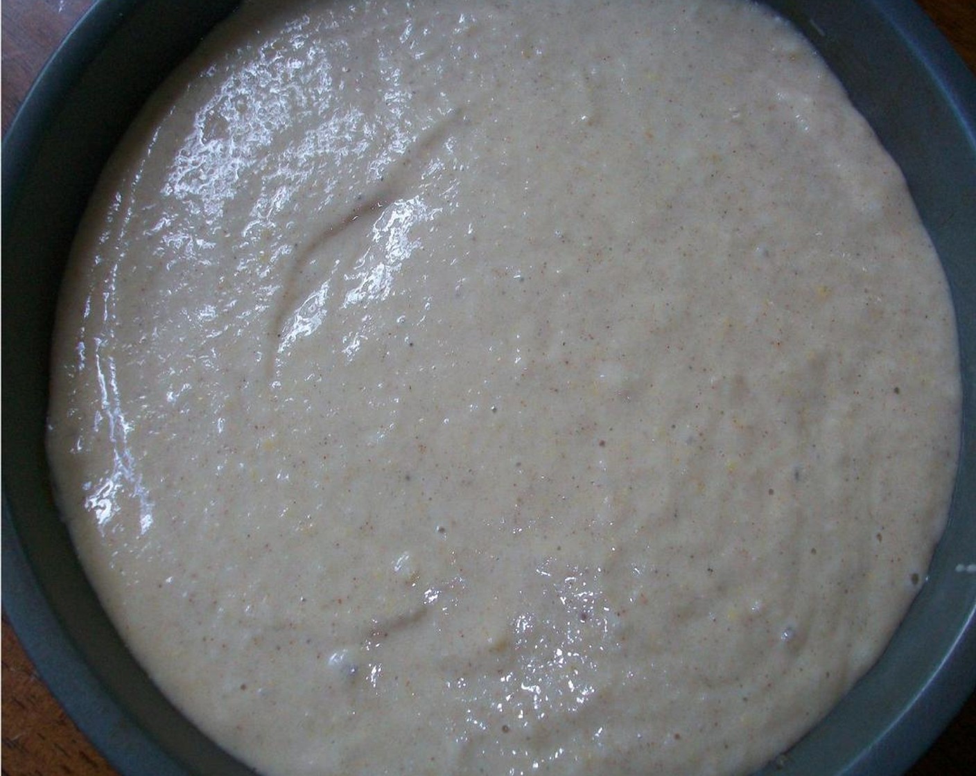 step 3 Combine All-Purpose Flour (1 1/4 cups), Caster Sugar (3/4 cup), Simply Organic Cinnamon, Ground (1 tsp), Baking Powder (1 tsp), Baking Soda (1/2 tsp), and Ground Nutmeg (1/8 tsp), in a large bowl. Add Non-Fat Milk (1/2 cup), Unsweetened Apple Sauce (1/2 cup), Farmhouse Eggs® Large Brown Egg (1), and Canola Oil (1 Tbsp) and stir until combined. Pour this over the apples.