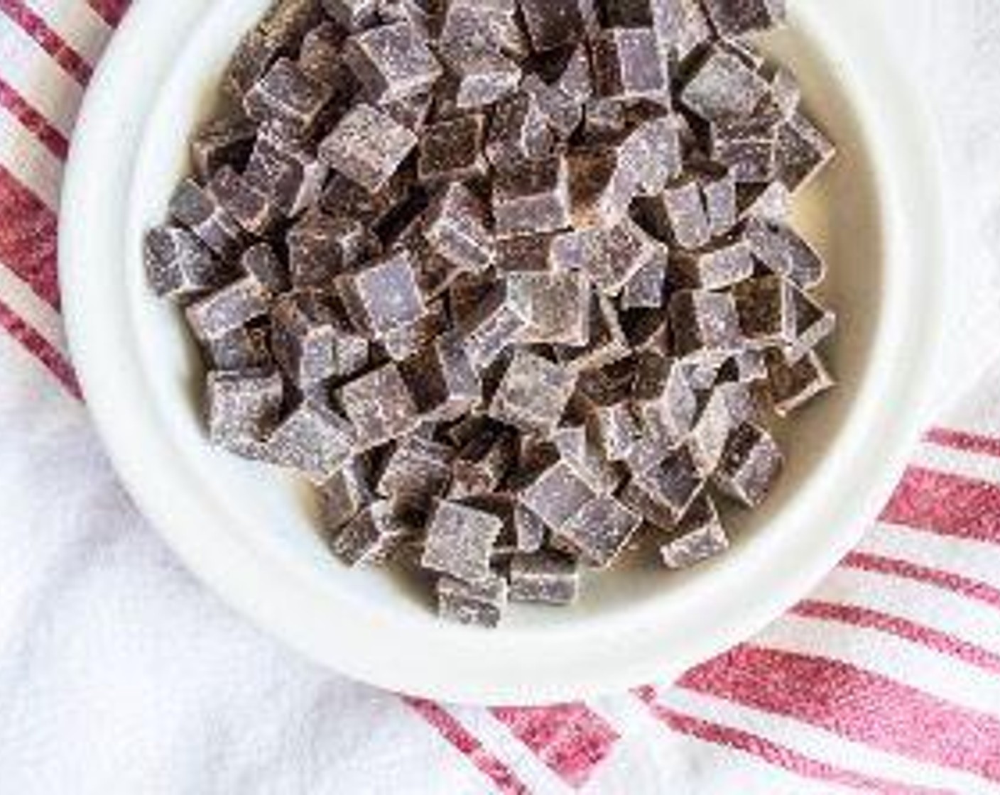 step 5 While toasted quinoa cools, melt Vegan Dark Chocolate Chunks (1 1/2 cups) and Coconut Oil (1/2 Tbsp) in double boiler if you have one, or melt in a small pot on low, stirring continuously and watching to make sure chocolate does not burn.