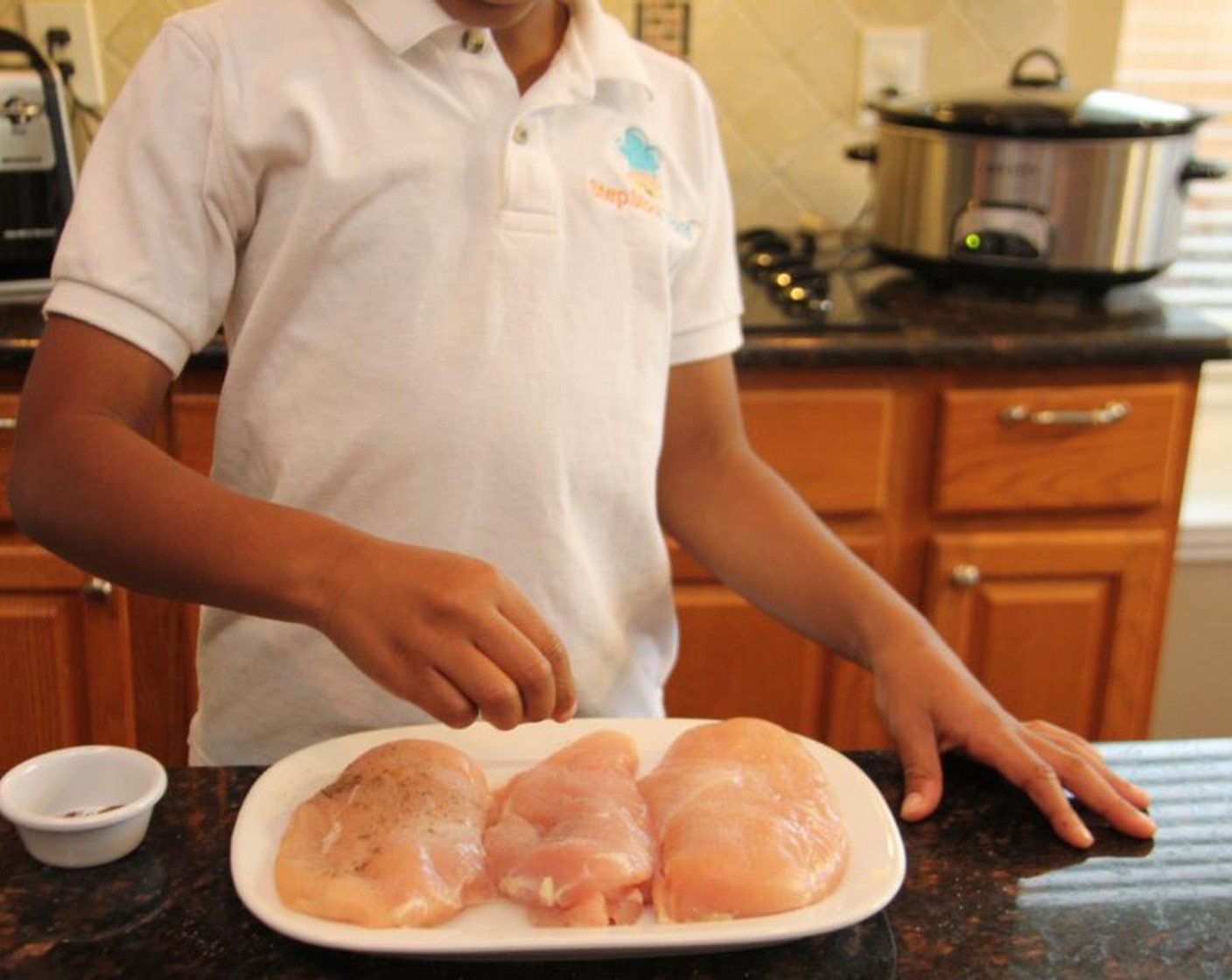 step 2 Season the Chicken Breast (1 lb) with Salt (1/8 tsp), Ground Black Pepper (1/8 tsp), McCormick® Garlic Powder (1 tsp) and Onion Powder (1 tsp) on both sides.