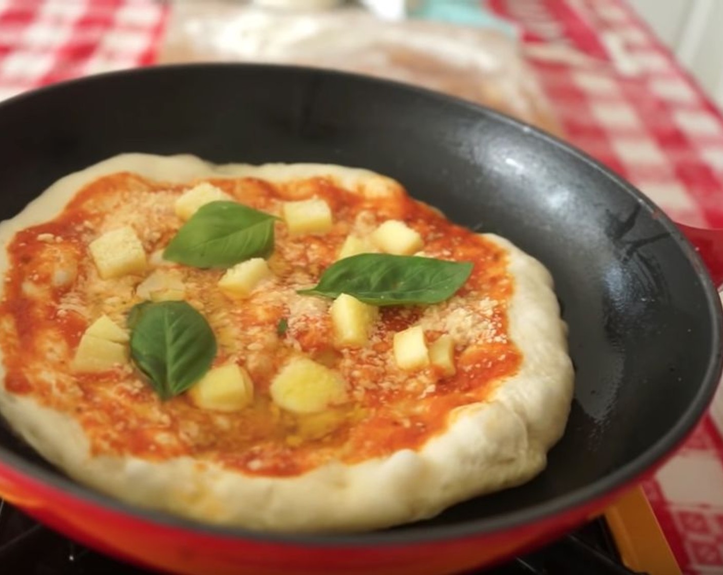 step 14 Cook for 3-4 minutes. Move the pizza around every so often by lifting the pan and turning it in a circular motion so it shifts around and doesn’t stick to the bottom. Add Fresh Basil Leaves (3).