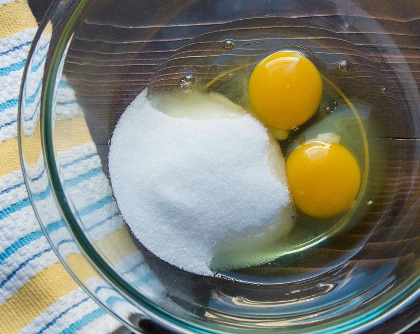 step 1 In a large bowl beat the Granulated Sugar (3/4 cup) into the Eggs (2) until thick and pale yellow.