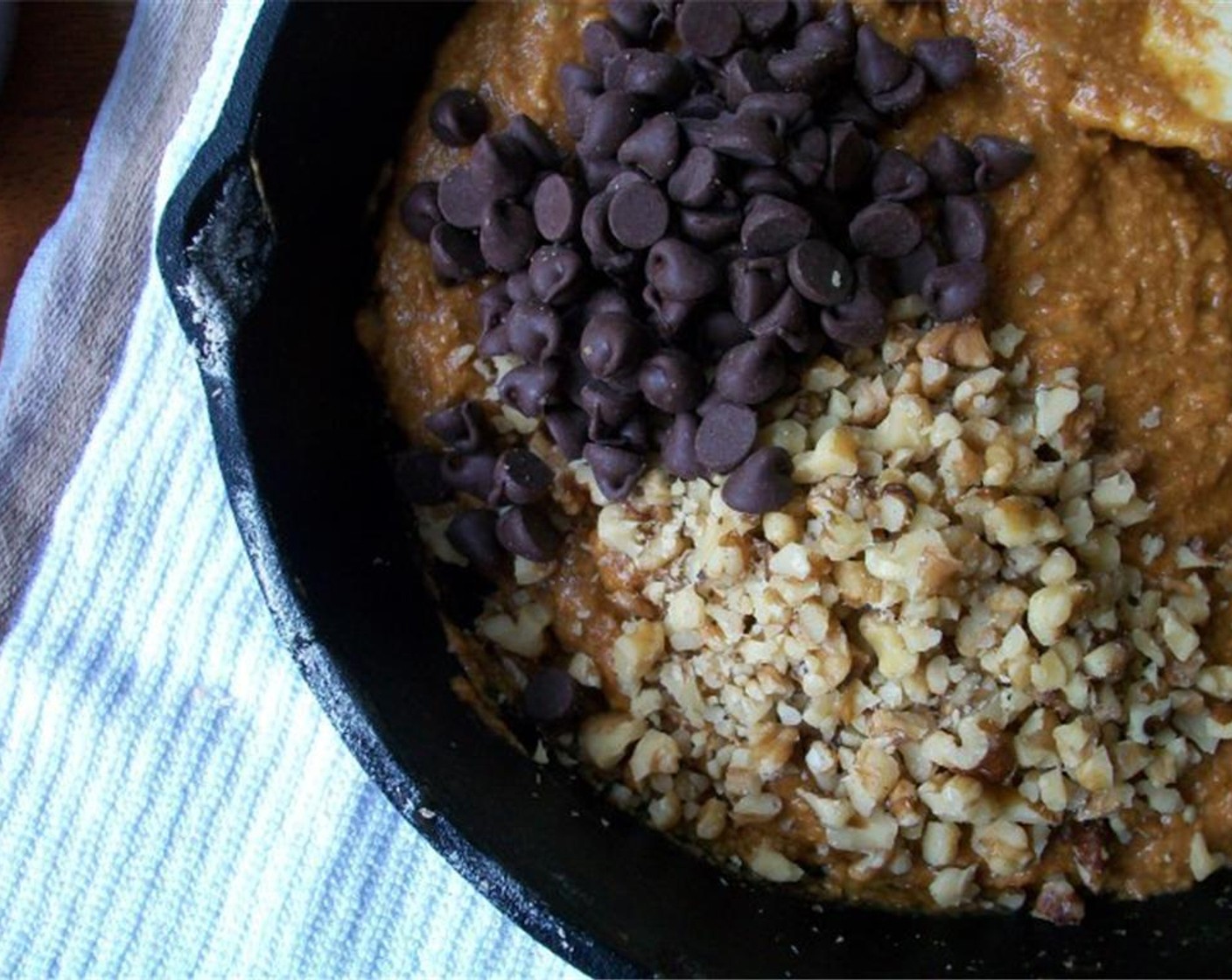 step 5 Finally stir in those Walnut (1/2 cup) and Semi-Sweet Chocolate Chips (1/2 cup). Smooth the top and place in a preheated oven for 15 to 20 minutes.