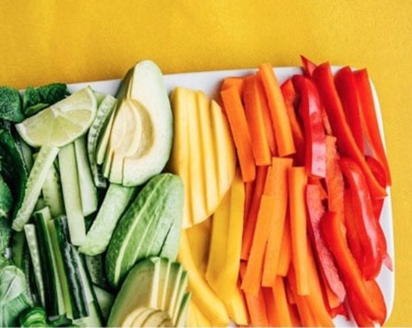 step 2 Arrange Carrots (2), Red Bell Pepper (1), Avocado (1), Mango (1), Cucumber (1/2), Jalapeño Pepper (1/2), Arugula (2 cups), Fresh Basil (1/2 cup), and Fresh Mint (1/2 cup) near your workspace.