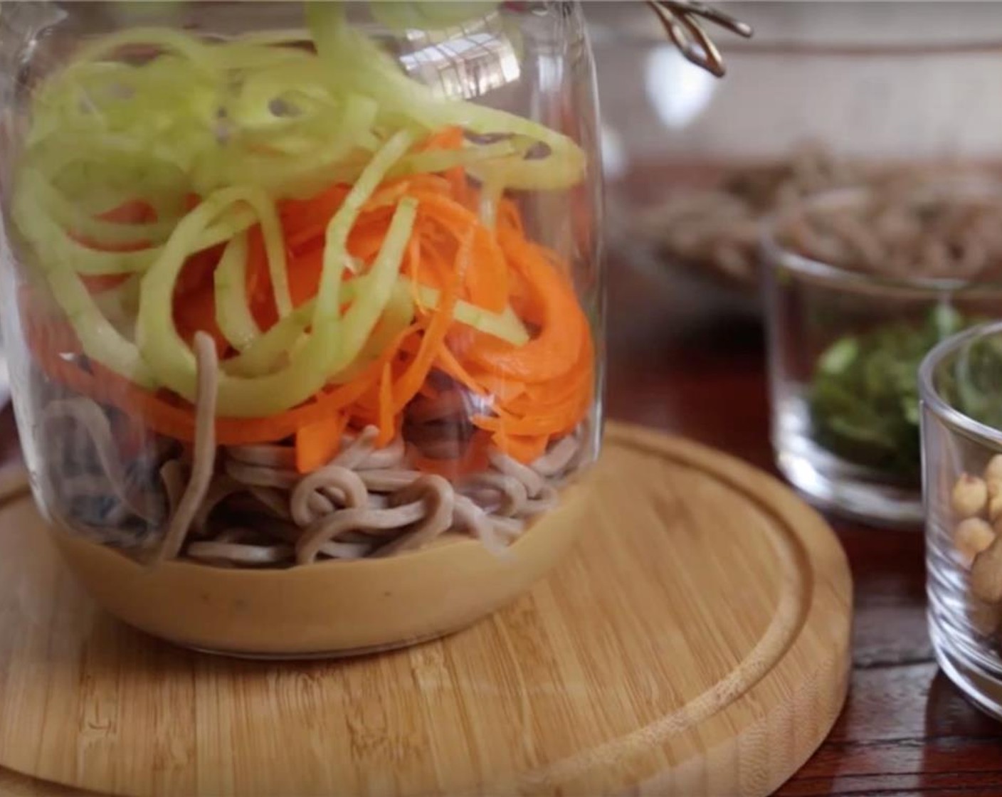 step 12 Add in spiralized carrots and cucumbers.