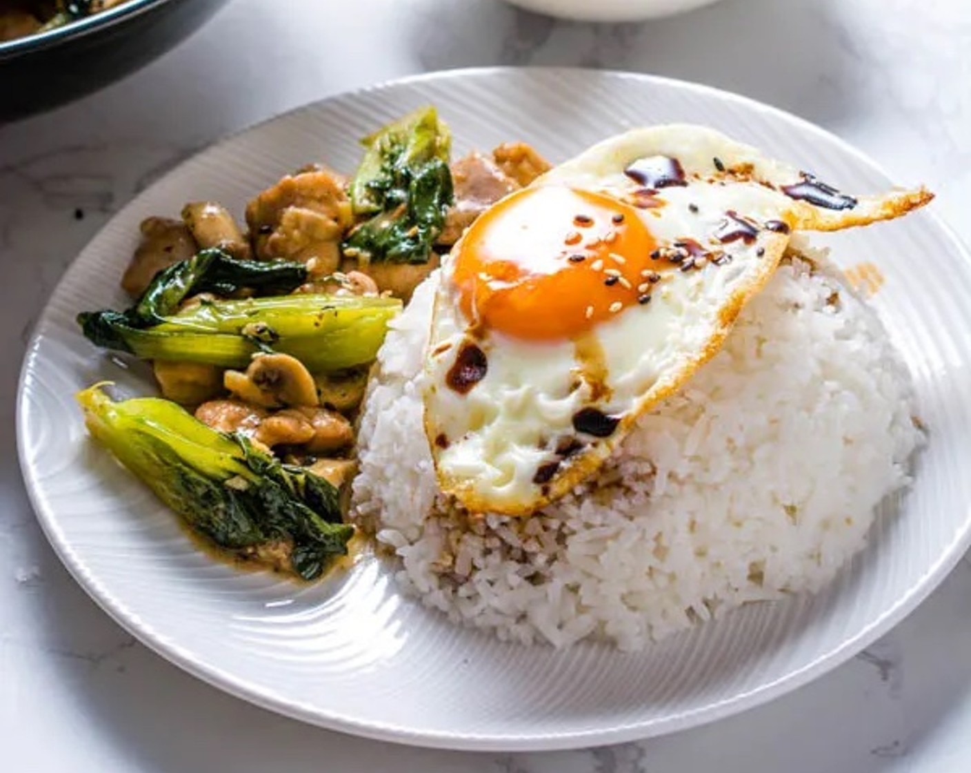 step 8 Serve with White Rice (as needed), topped with an Eggland's Best Classic Eggs (4) and Light Soy Sauce (1 splash). Enjoy!