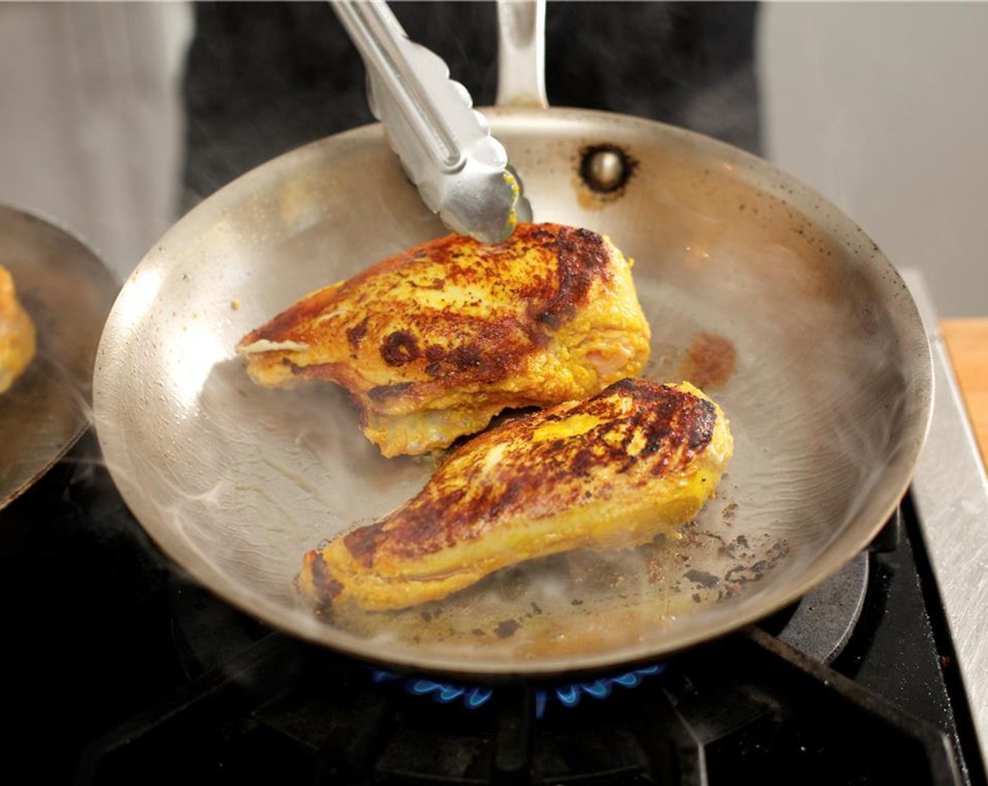 step 15 Once the oil is hot, add the chicken to the pan and brown on both sides, about three minutes each.