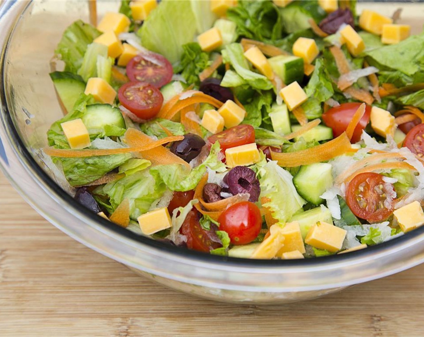 step 3 In large bowl, toss the Salad Greens (3 cups), Pea Shoots (1 bunch), grilled asparagus, Cucumber (1), Grape Tomatoes (1 cup), Daikon Radish (1 cup), Kalamata Olives (1/2 cup) and Sharp White Cheddar Cheese (2 cups).