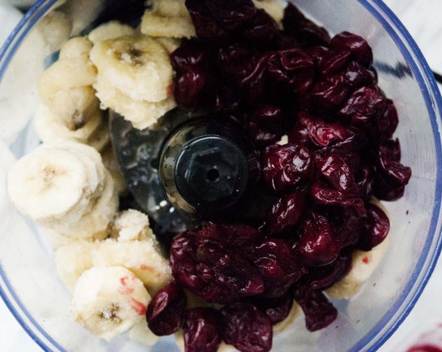 step 1 Place Bananas (3) and Frozen Cherries (2 cups) in a food processor and blend until creamy.