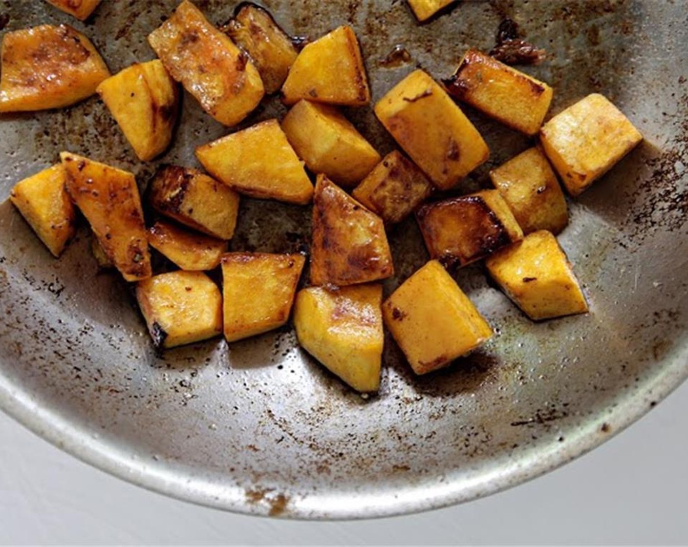 step 2 In a medium-large saucepot over medium-high heat, add 4 cups of Water. While waiting for water to boil, place a large sauté pan over high heat, and add small butternut squash, 2 cups of Water, and Olive Oil (1 Tbsp).