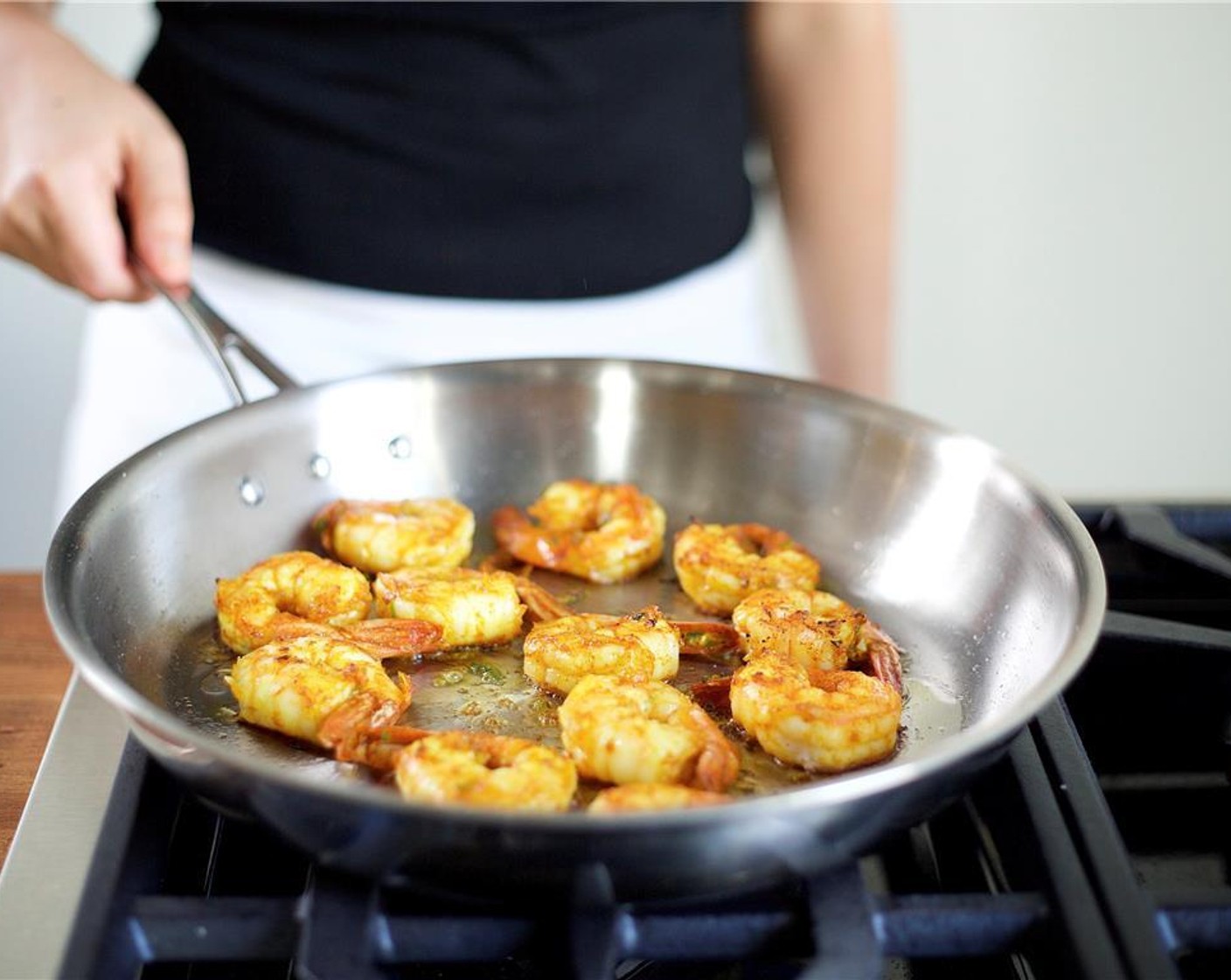 step 9 Remove excess marinade from the shrimp before cooking. Carefully add the shrimp to the saute pan in a single layer. Cook for two minutes on each side until they get a nice char. Remove from heat and keep warm.