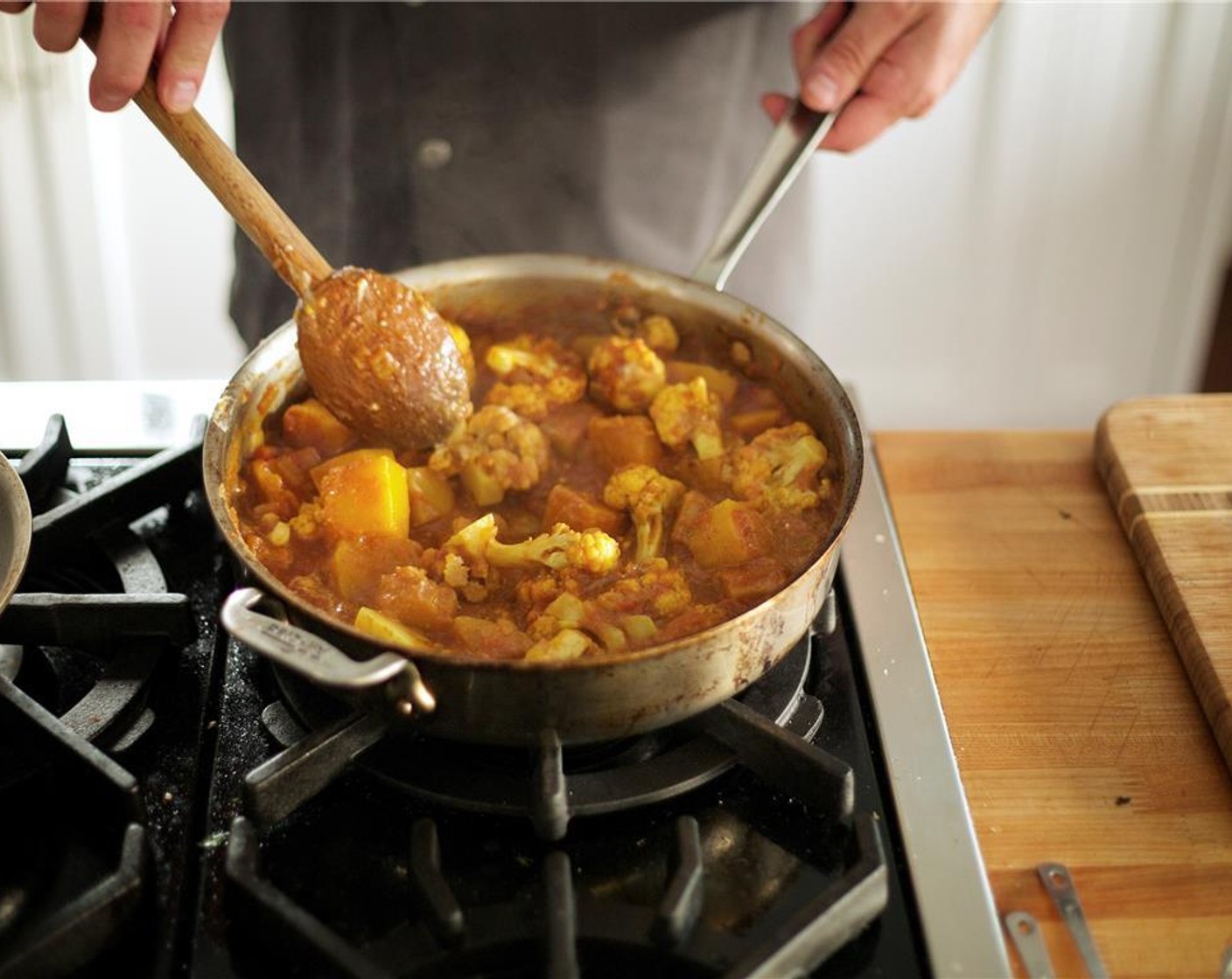 step 13 Mix half a cup of warm water with Vegetable Base (1 pckg) in a small bowl to make broth. Add broth, Canned Crushed Tomatoes (3 1/3 cups), Butternut Squash (2 1/2 cups) and Cauliflower Florets (3 cups) to the pan. Cover and bring to a boil.