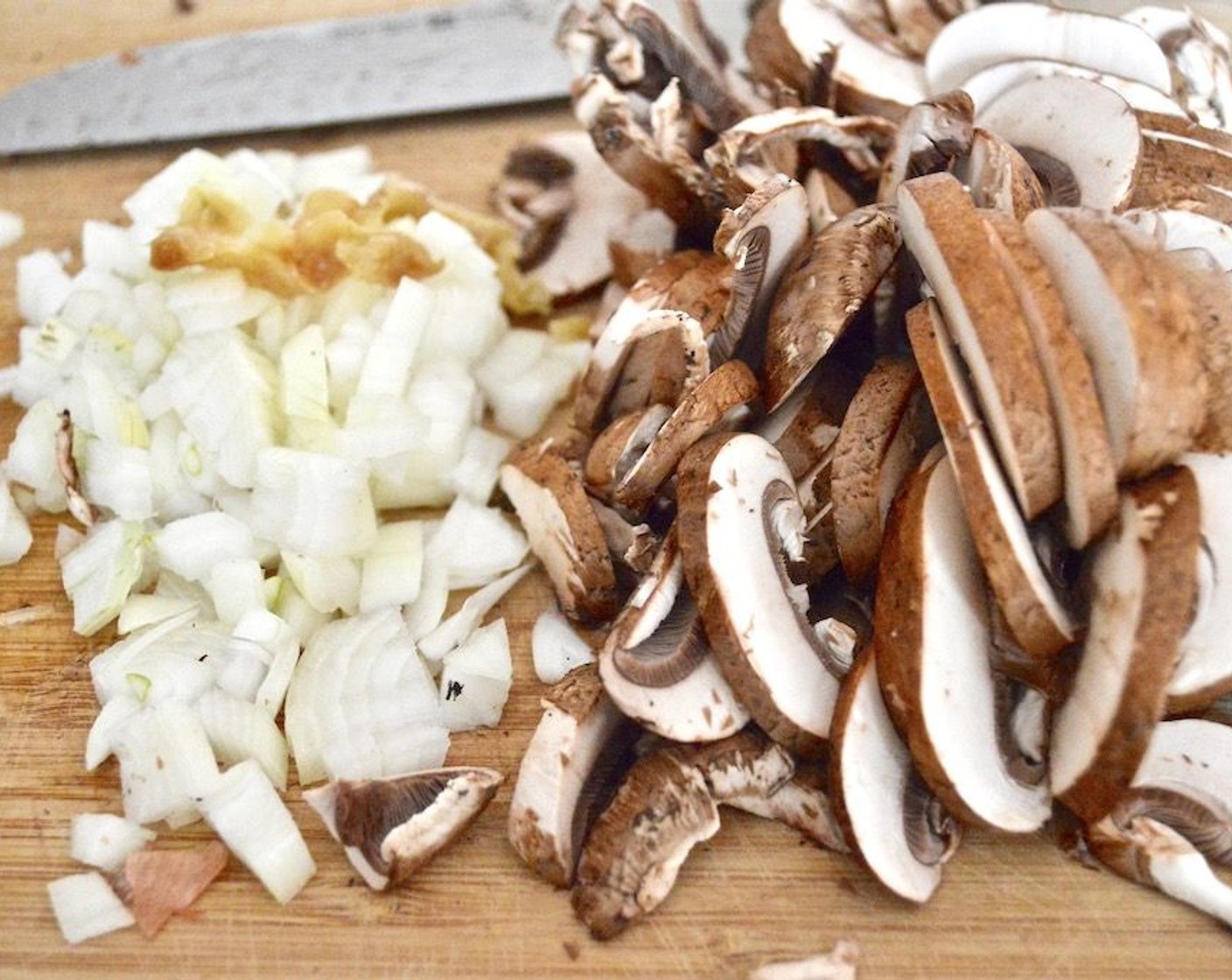 step 4 Add Cremini Mushrooms (2 3/4 cups), Onion (1), and Garlic (4 cloves) to the pan and let them cook for 3 minutes or so to soften and become fragrant.
