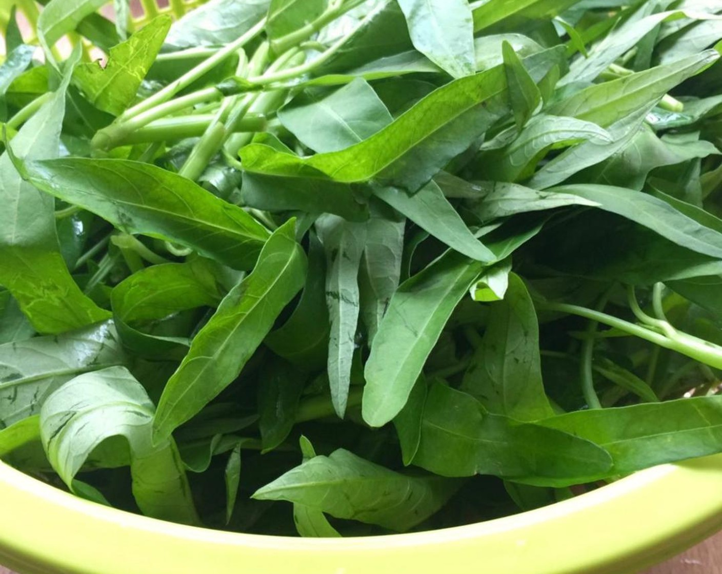 step 2 Pluck or cut the water spinach into smaller sections and set aside.