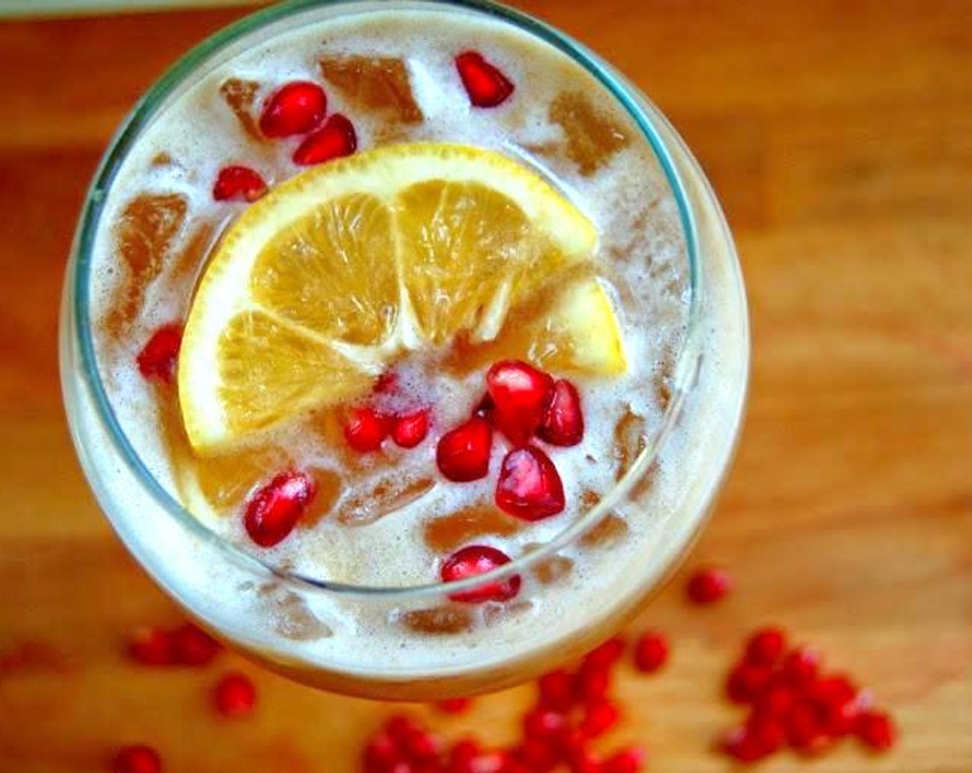 step 2 Add Ice (to taste) and fill with Club Soda (to taste).  Garnish with a slice of lemon and Pomegranate Seeds (to taste).