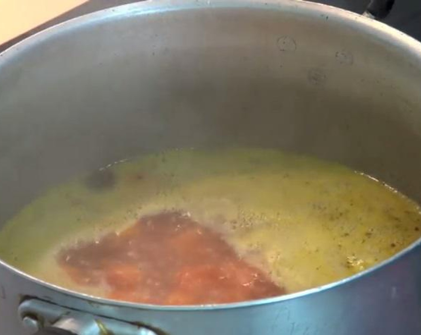 step 2 Inside a pot over a high heat, mix together the Chicken Stock (2 cups), Water (2 cups), Garlic (2 cloves), the roasted carrots, and some Freshly Ground Black Pepper (to taste). Put the lid on until the mix comes to boil.